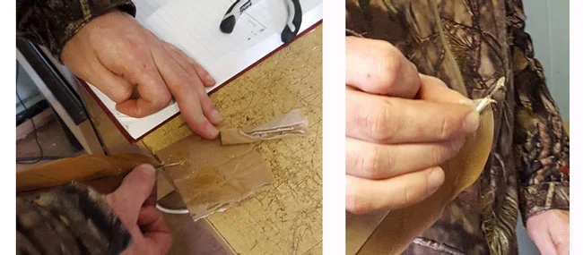  The correct feather is selected from the 'feather bank', cleaned, and the imping needle inserted