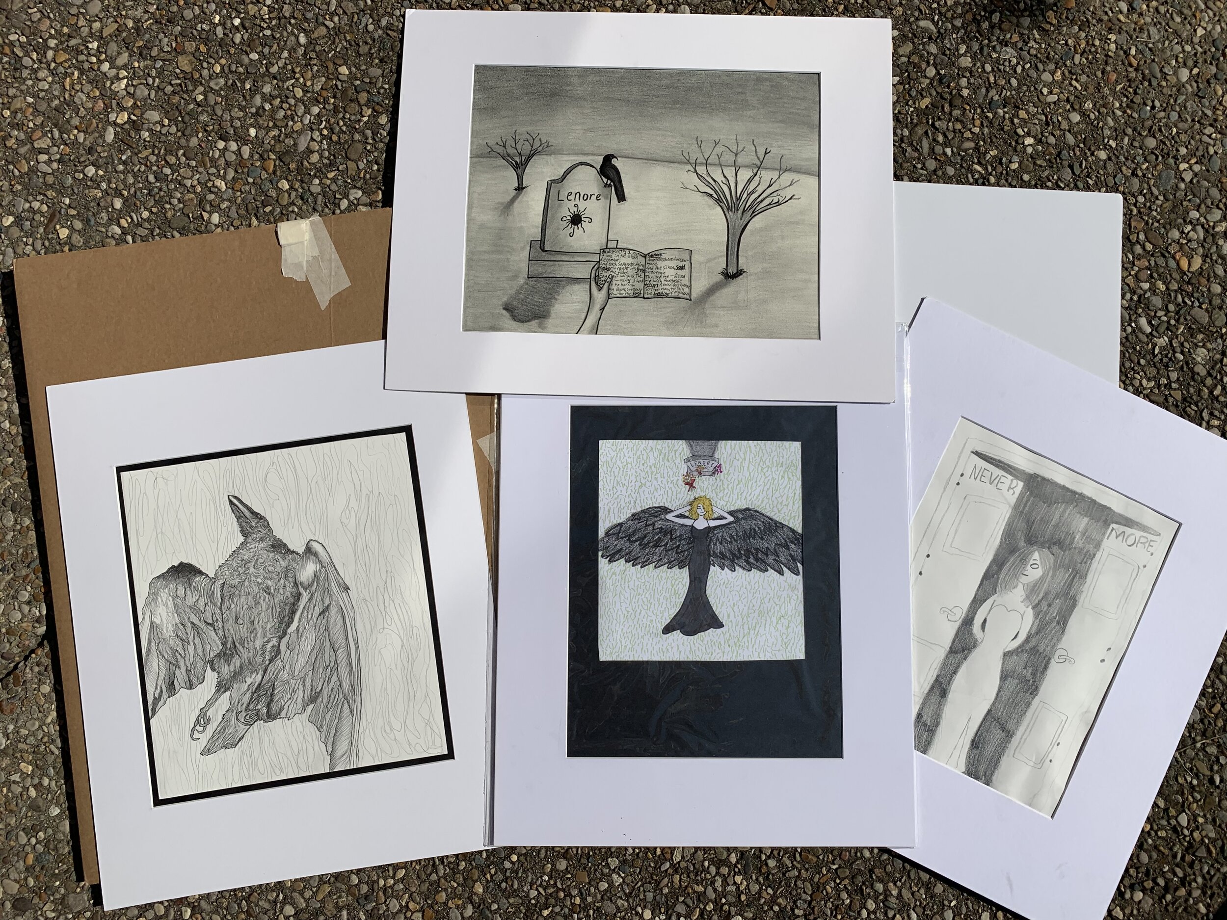 Several pieces of student work submitted to the Edgar Allen Poe Exhibit