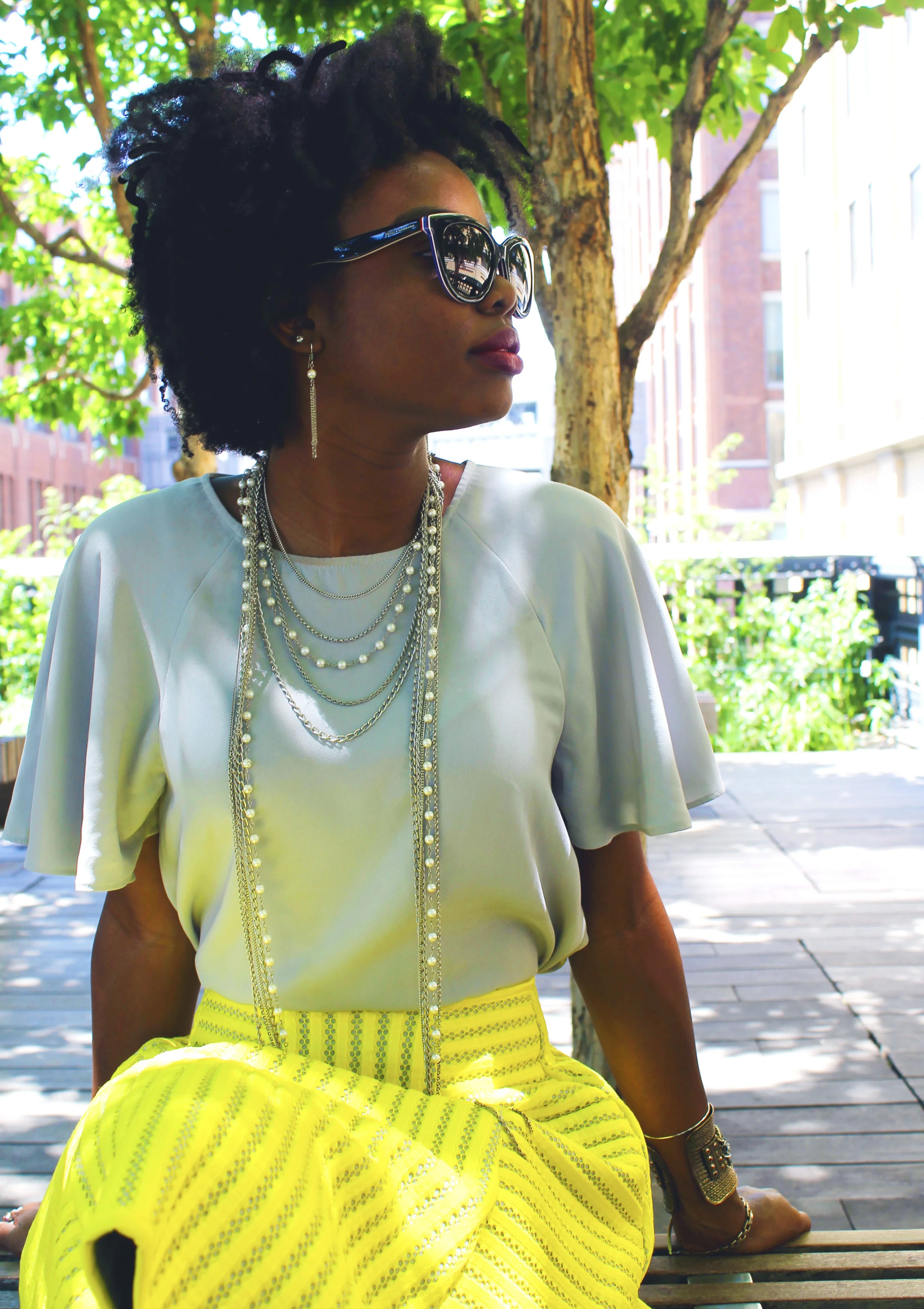 Shirt: Philosophy; Skirt: H&M; Shoes: Worthington's; Earrings: Macy's; Necklace: Macy's; Sunglasses: Dolce & Gabanna