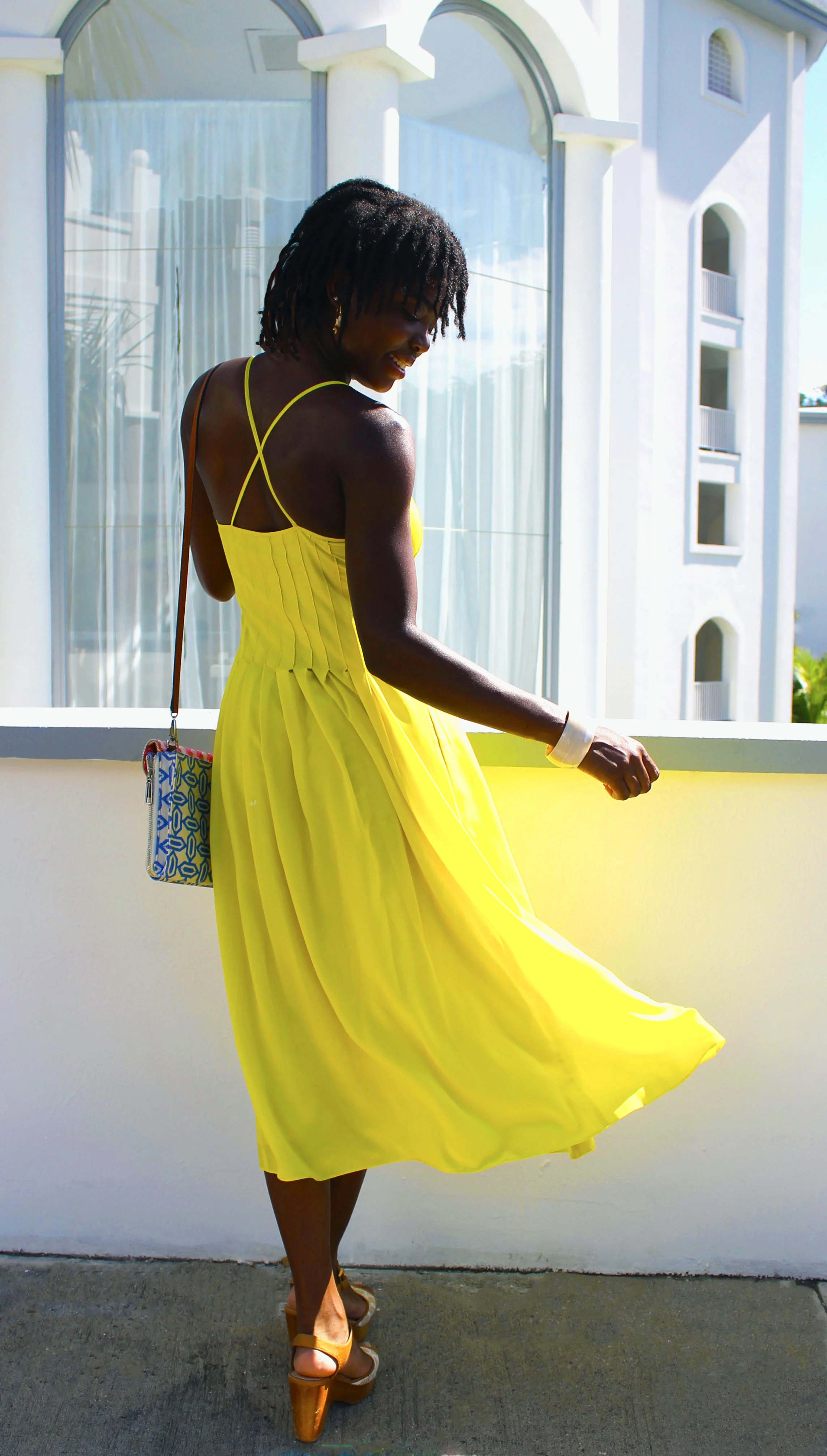 Dress: Banana Republic; Shoes: Coach; Bag: Rebecca Minkoff; Bracelet: J. Crew (pink), boutique in Argentina (beige)