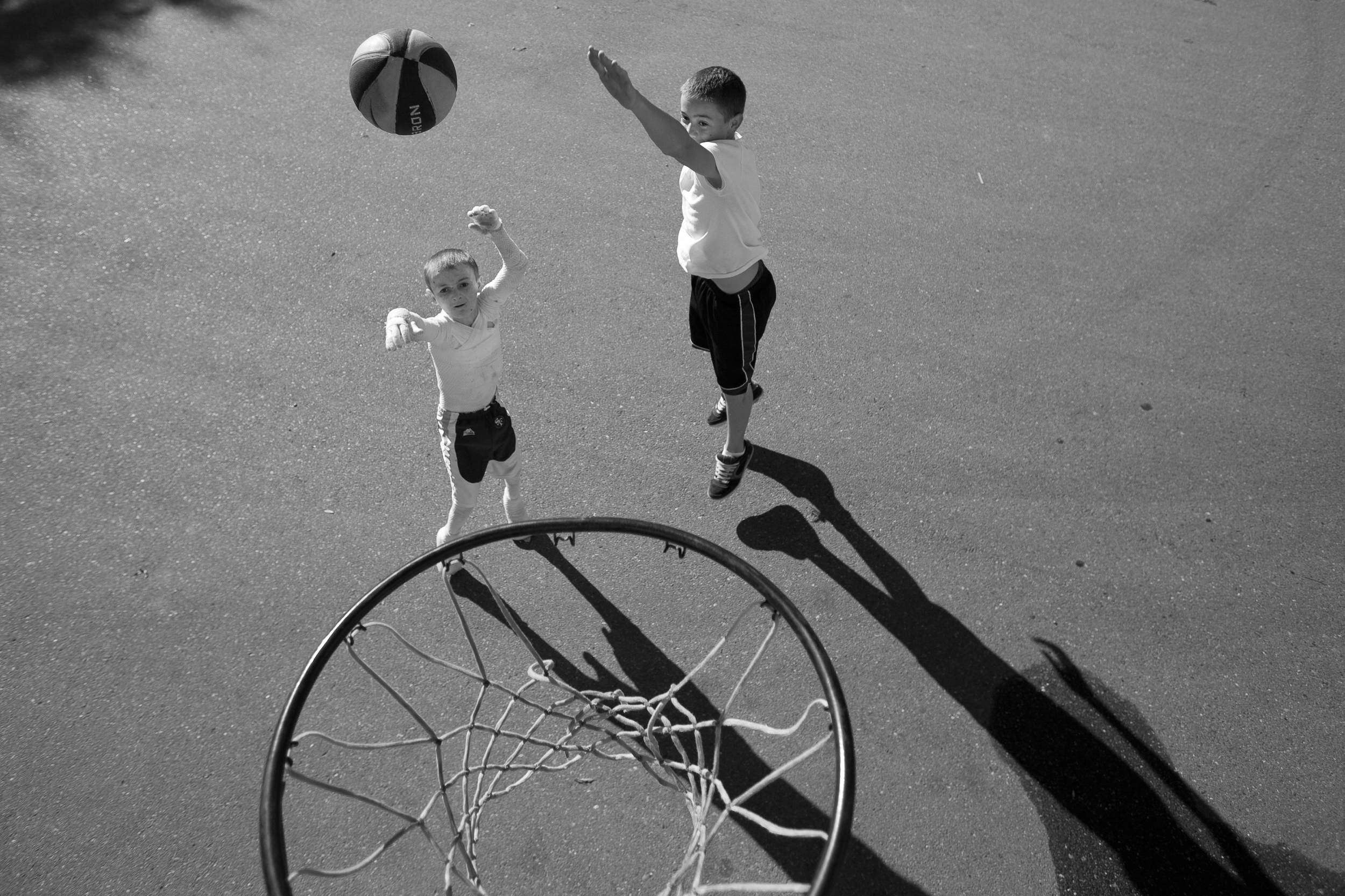  A very rare moment, one morning during a school holiday, Garrett felt surprisingly good enough to go out and play ball in the street with his brother. His mom had to add extra layers of bandaging to his fingers so he could handle the rough basketbal