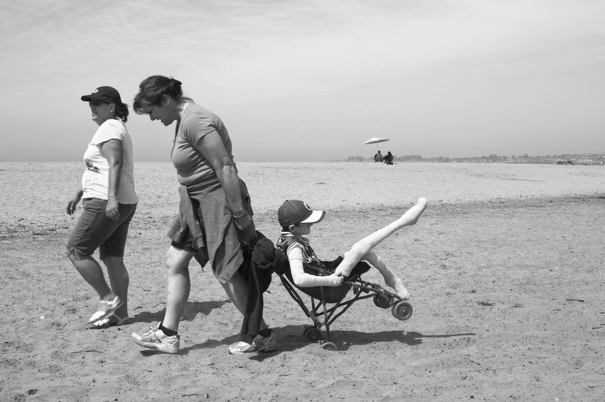  Lorraine Spaulding, pulls Garrett across the hot sand in a stroller to meet the rest of his class during a class field trip to the beach. Lorraine admits that ther life changed drastically after having Garrett who was born with Epidermolysis Bullosa