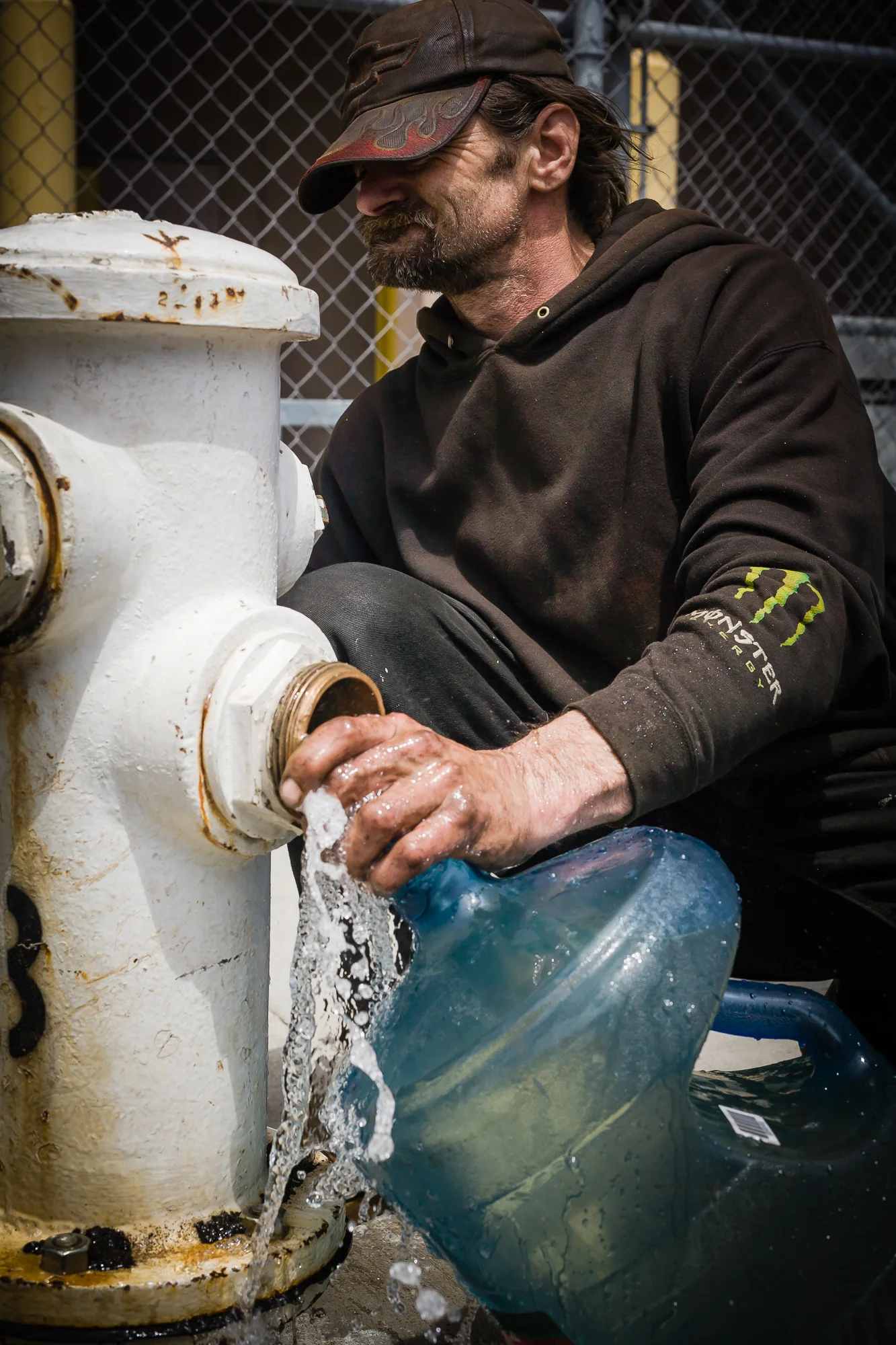 The homeless are extremely resourceful. They have many different water sources depending on the use. Steve taps into the city's water main at a fire hydrant to get water for cooking, and their pets.