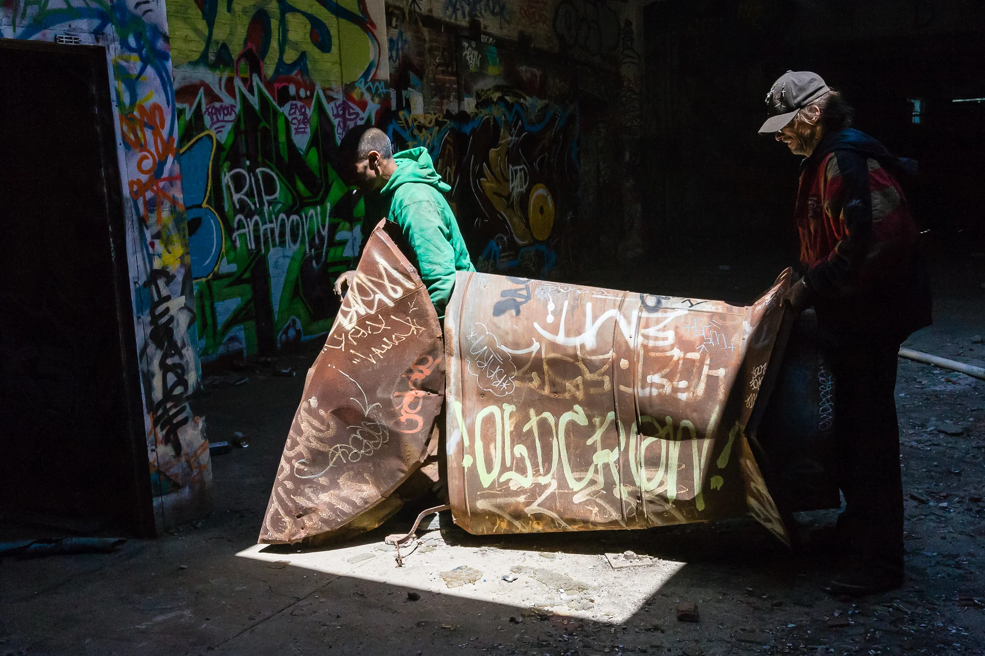 Steve, and another scrapper, who chose to remain nameless, work to remove one of many ventilation ducts from the roof of this abandoned factory. This, along with the rest of the scrap extracted from the abandoned building will be loaded into a truck and taken to a scrap yard to sold.