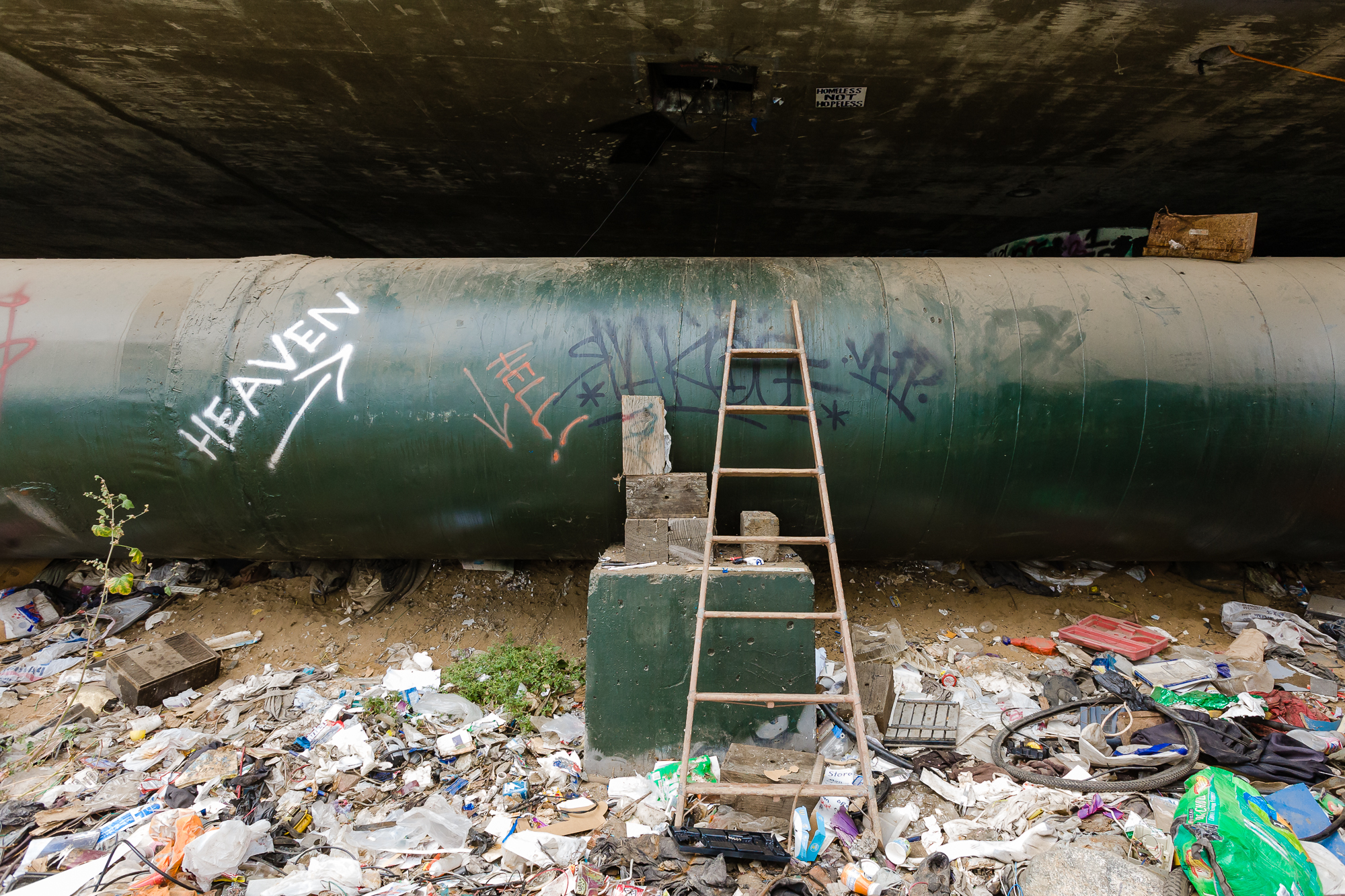  Located underneath a major freeway off-ramp is a homeless camp like no other. At this specific location are 4x4x20 foot storage spaces inside the freeway, providing secure, protected living for the lucky few who happened to be in the right place at 