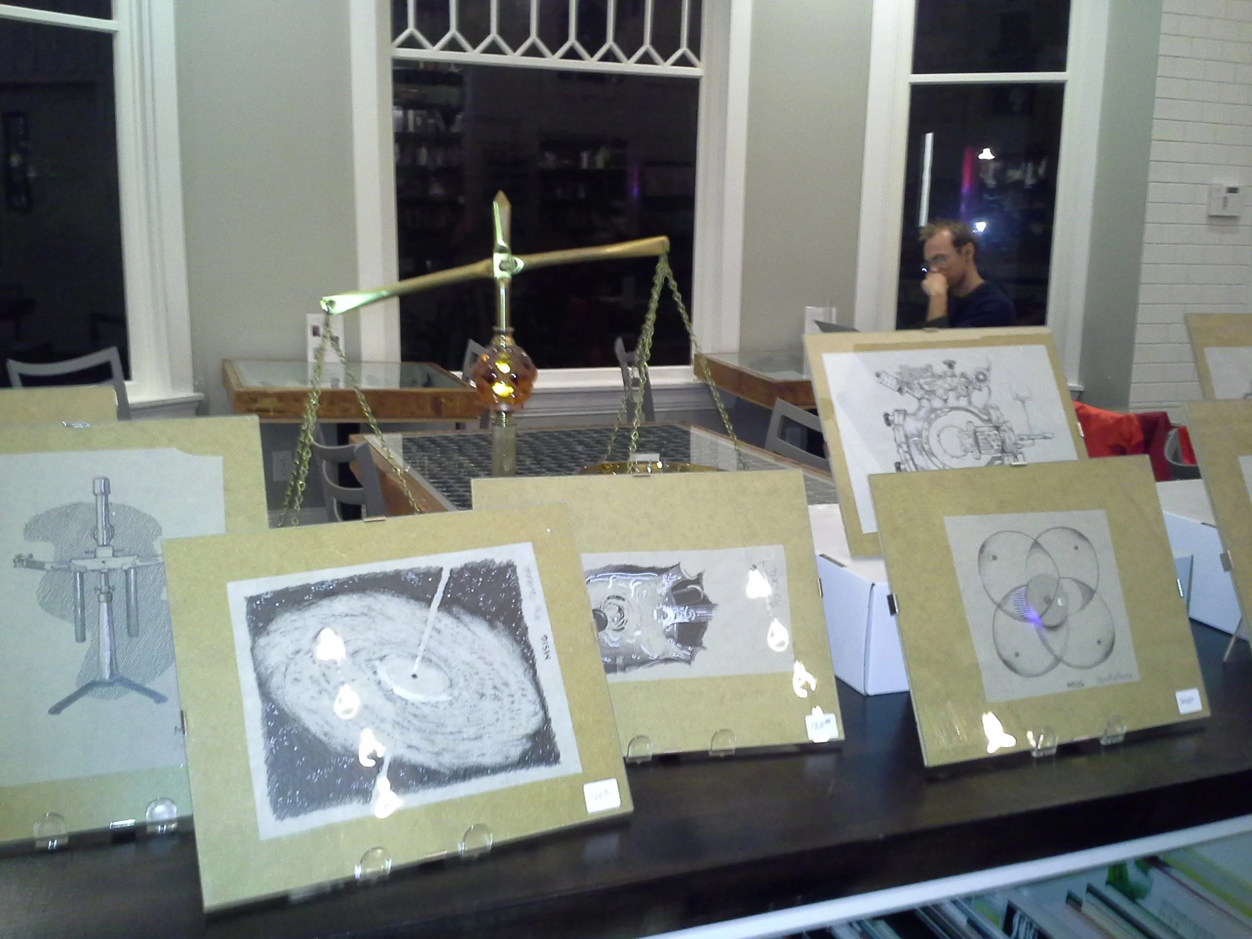 Matt Schmidt's artwork on display at Ada's Books.