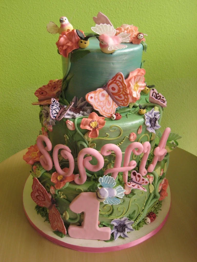 A secret garden birthday cake filled with little ladybugs, bees, butterflies, birds and flowers. So sweet!