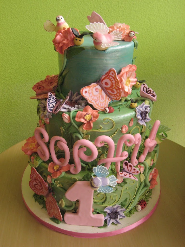 A secret garden birthday cake filled with little ladybugs, bees, butterflies, birds and flowers. So sweet!