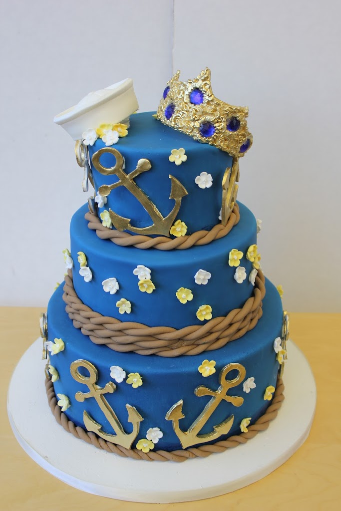 For darker colors like navy and black, I always use fondant since coloring buttercream this dark will turn everyone's mouth blue and black. Not cute for your wedding pictures!