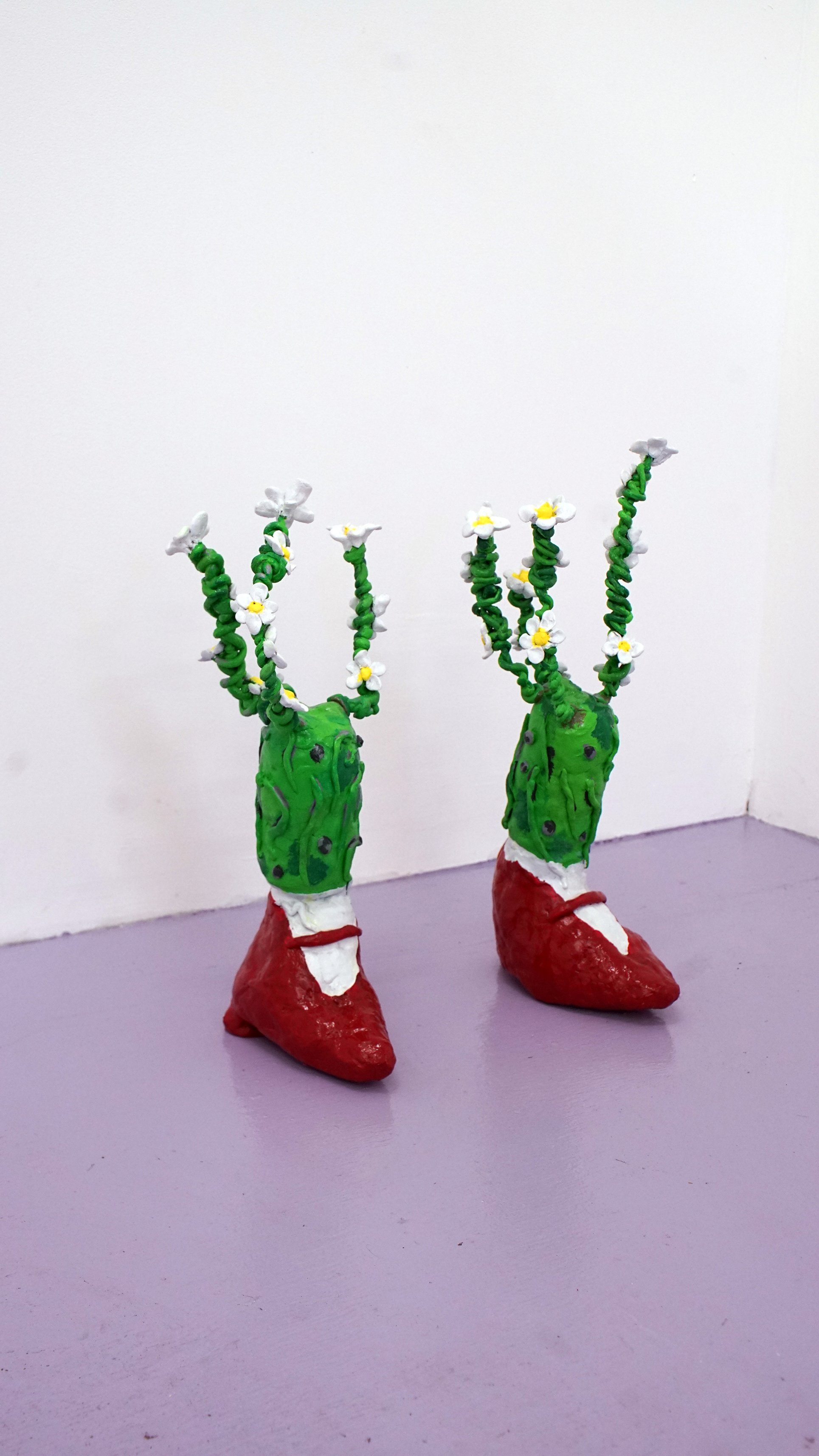  Flower Feet, 2017  Epoxy sculpt, acrylic, 18 x 14 inches  Installation image from: “Daisy Chain Heart Ecology,” 2017 