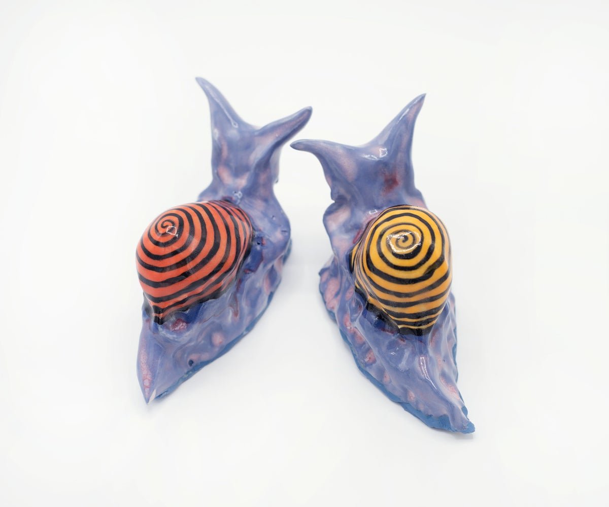  “Snails”  White Stoneware, 2022  Left Snail: 4.75” x 2” x 2.5” ; Right Snail: 4.5” x 2” x 2.5” 