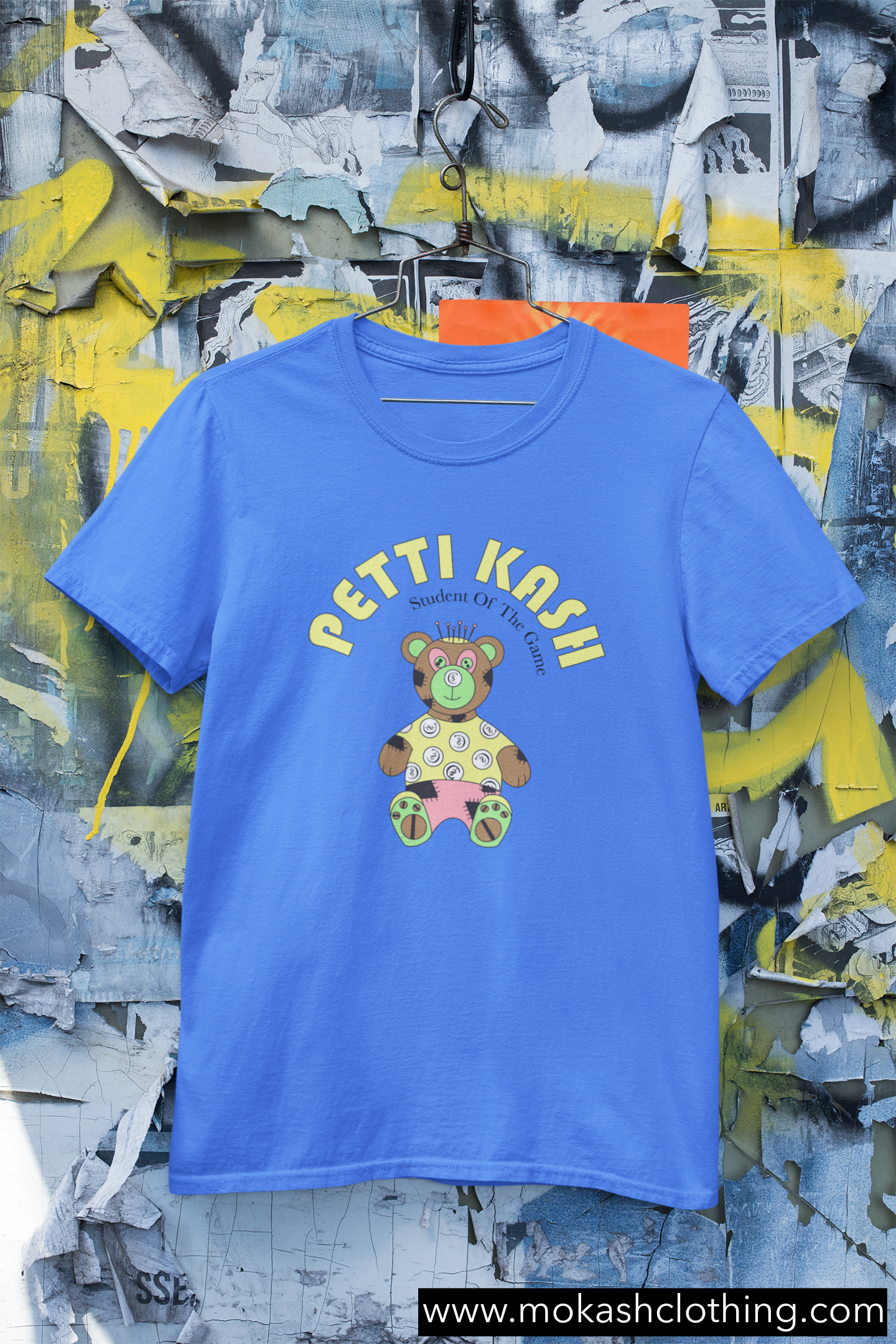 mockup-of-a-hanged-round-neck-t-shirt-against-an-urban-wall-m430 copy 2.png