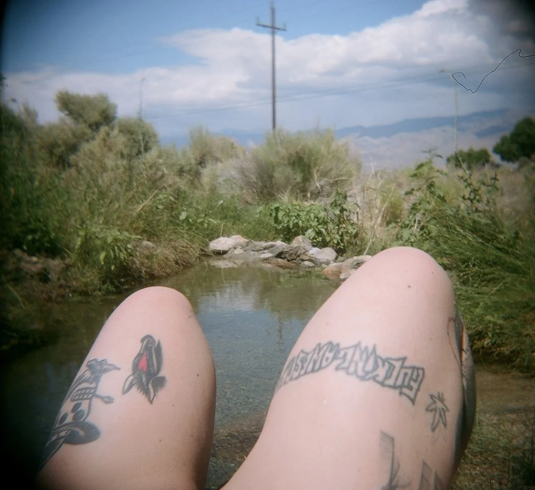 Ali, Praying on Highway 395, 2023.
Color photograph, Holga camera.