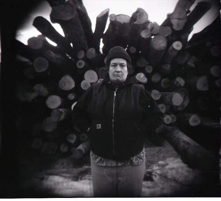 Ali, Logs, 2026.
Black-and-white photograph, Holga camera.