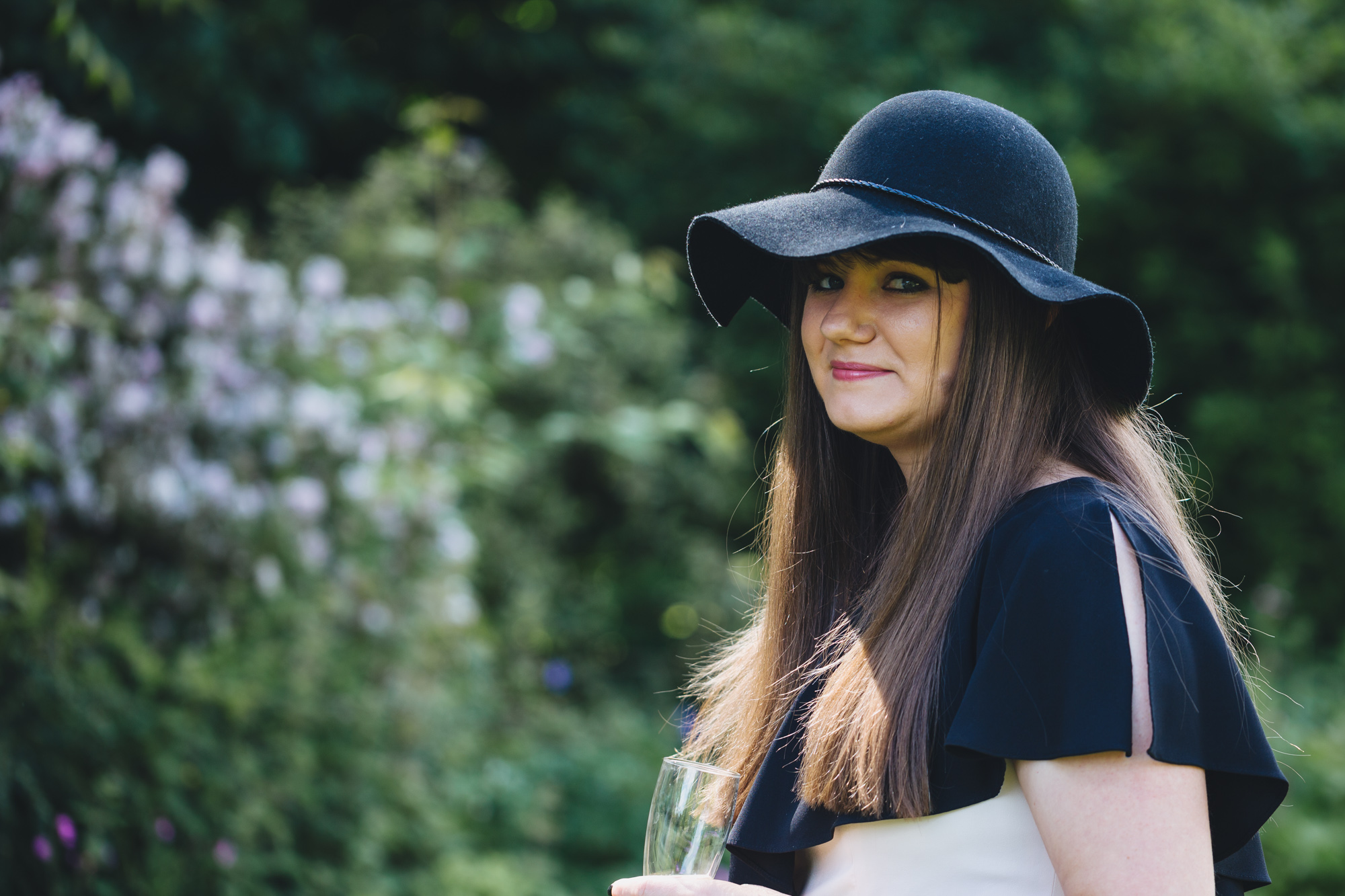wedding guest in cool hat by south wales wedding photographer