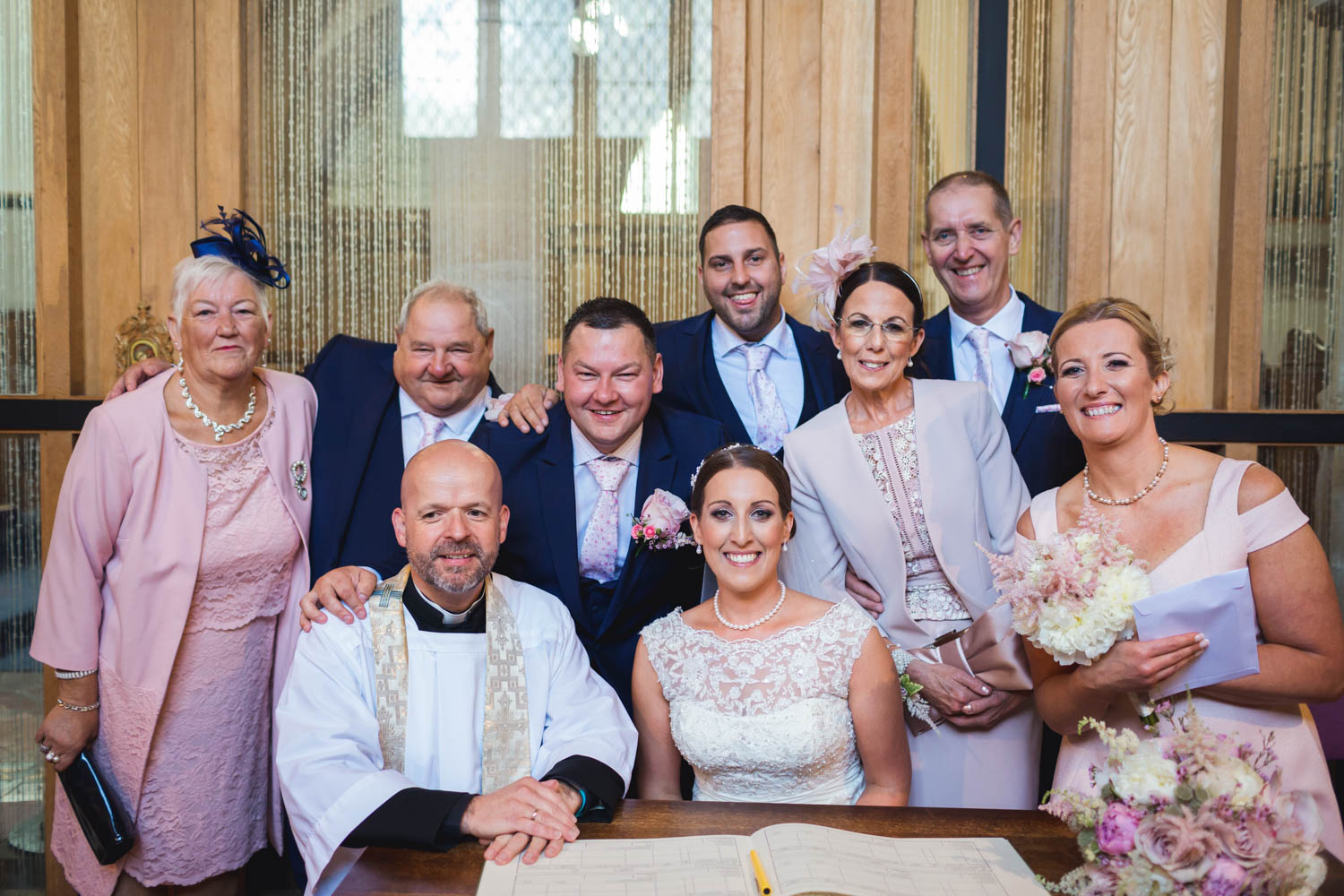 Signing of the register group shot at St Martins church Caerphilly with south wales wedding photographer