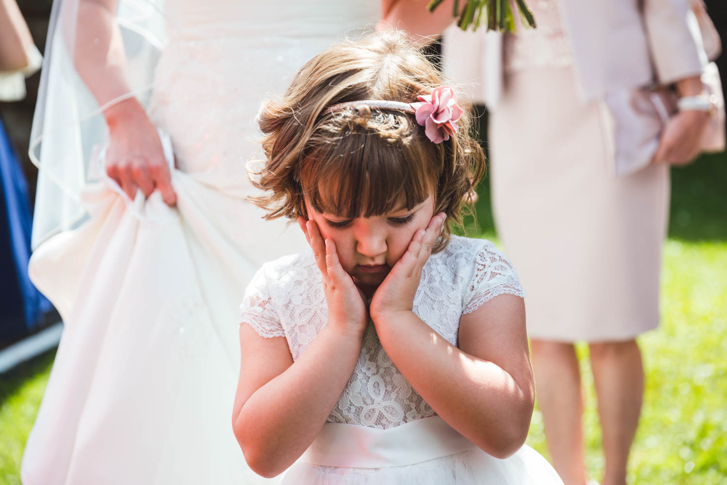 cute bridesmaid outside St Martins church Caerphilly with south wales wedding photographer