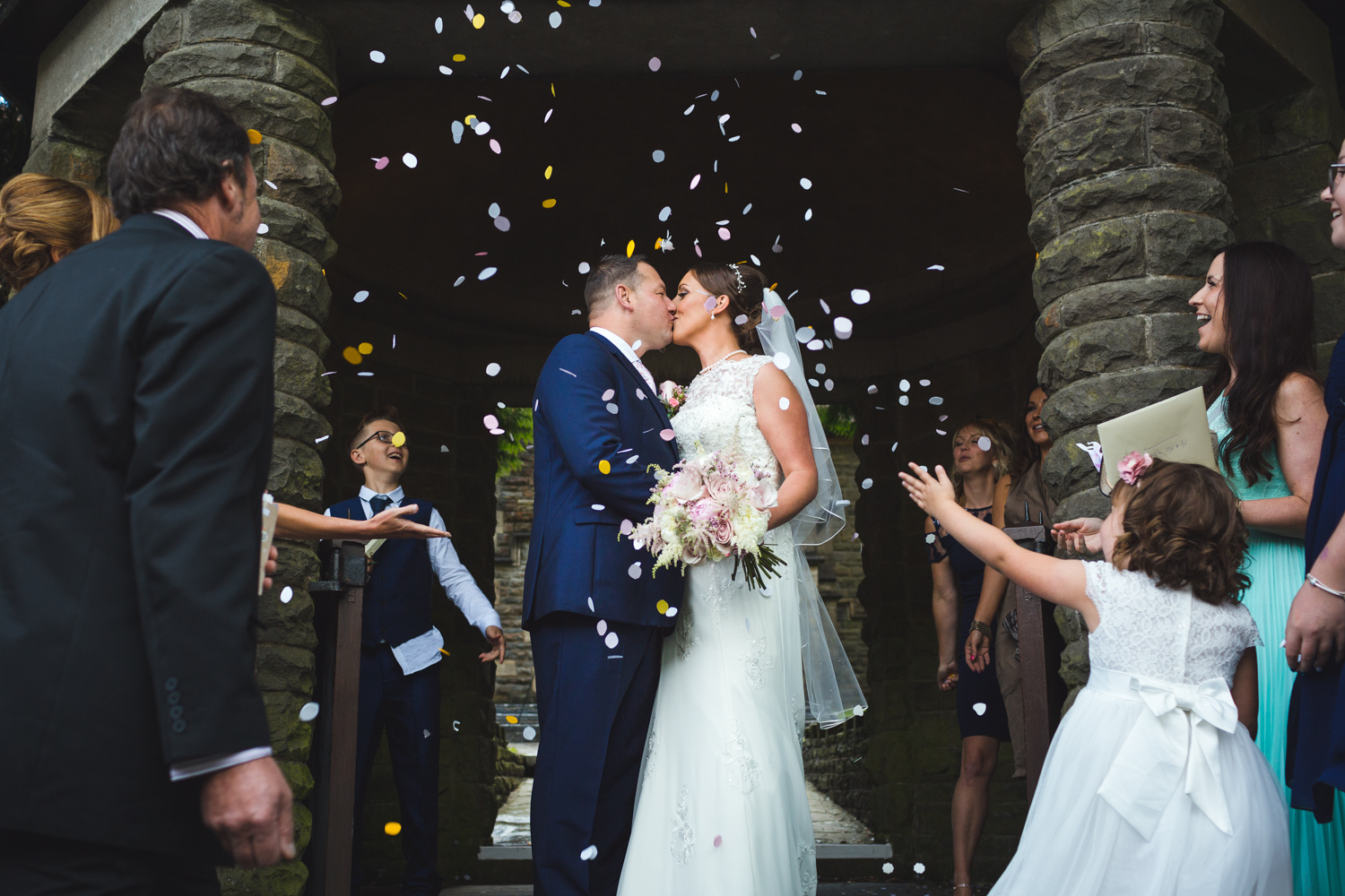 Confetti photos outside St Martins church Caerphilly with south wales wedding photographer