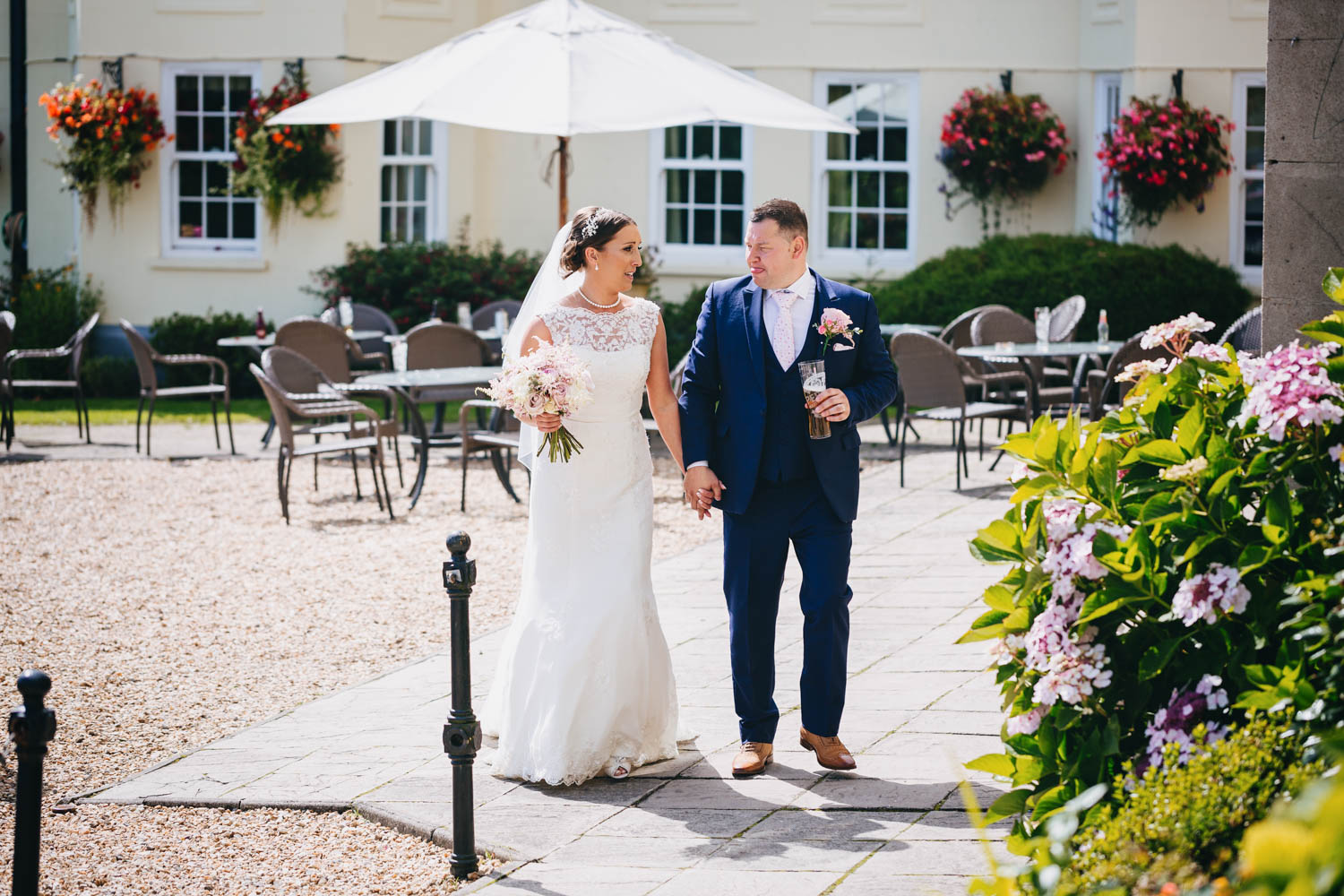 Bride and groom walking in The New House Country Hotel, Thornhill, Cardiff with south wales wedding photographer