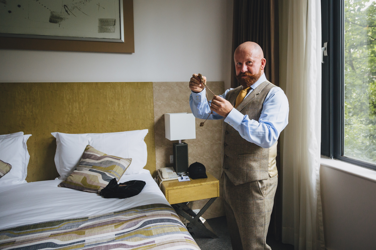 groom prep for gay wedding at park plaza hotel and cardiff city hall with gay friendly south wales wedding photographer