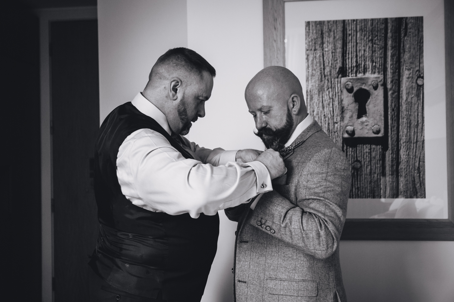 groom prep together for gay wedding at park plaza hotel and cardiff city hall with gay friendly south wales wedding photographer