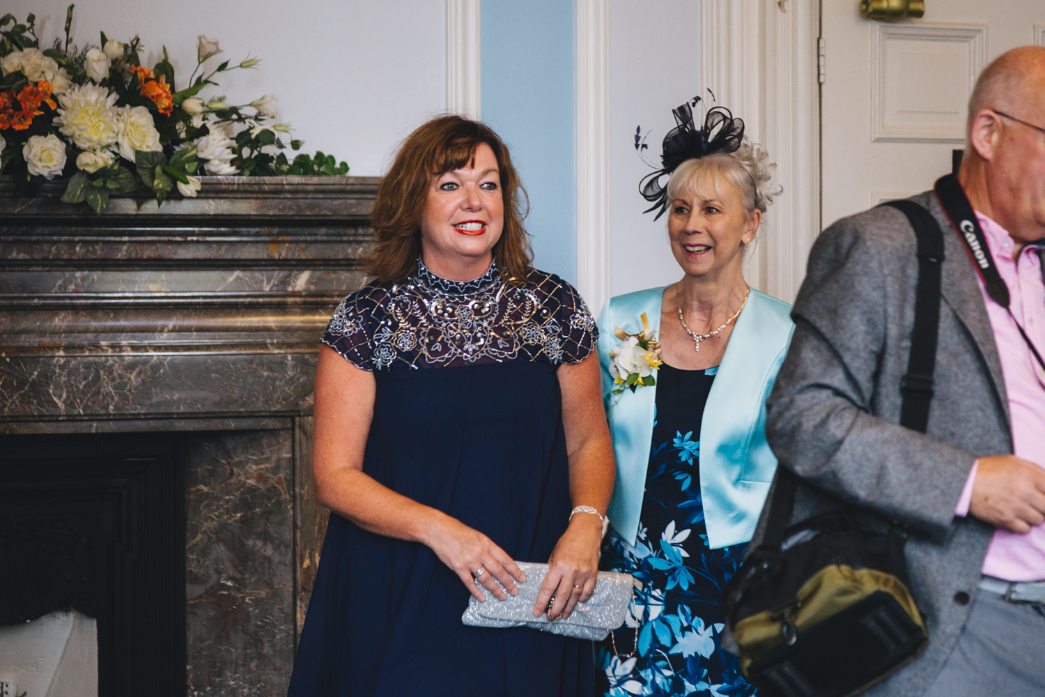 guests at gay wedding ceremony at cardiff city hall with gay friendly south wales wedding photographer