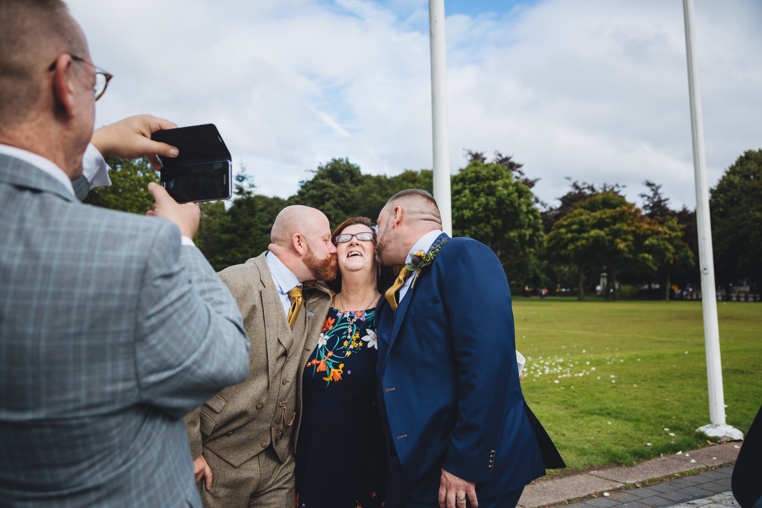 wedding guests at gay wedding at cardiff city hall and museum with gay friendly south wales wedding photographer