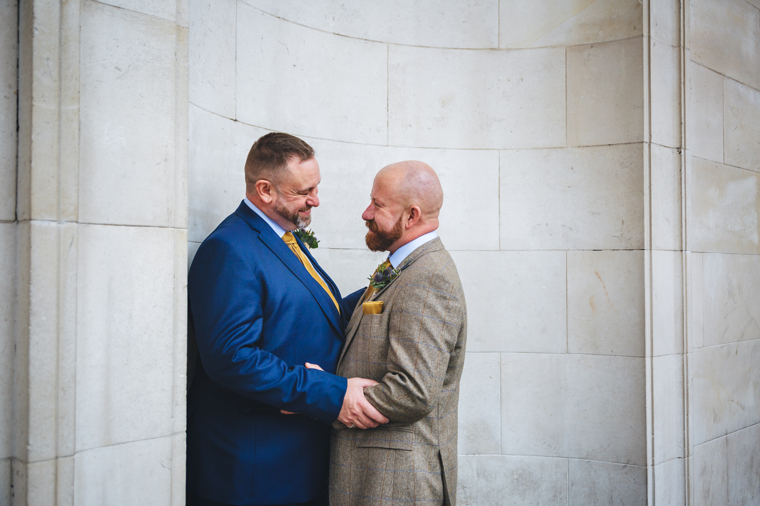 2 grooms newly wed at Park Plaza Hotel Cardiff with gay friendly south wales wedding photographer