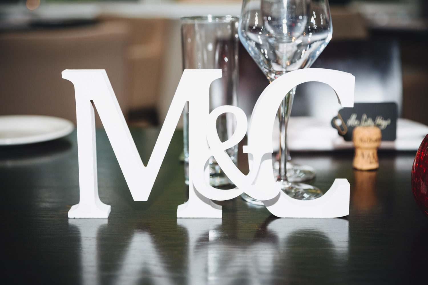 table decorations for 2 grooms at Park Plaza Hotel Cardiff with gay friendly south wales wedding photographer