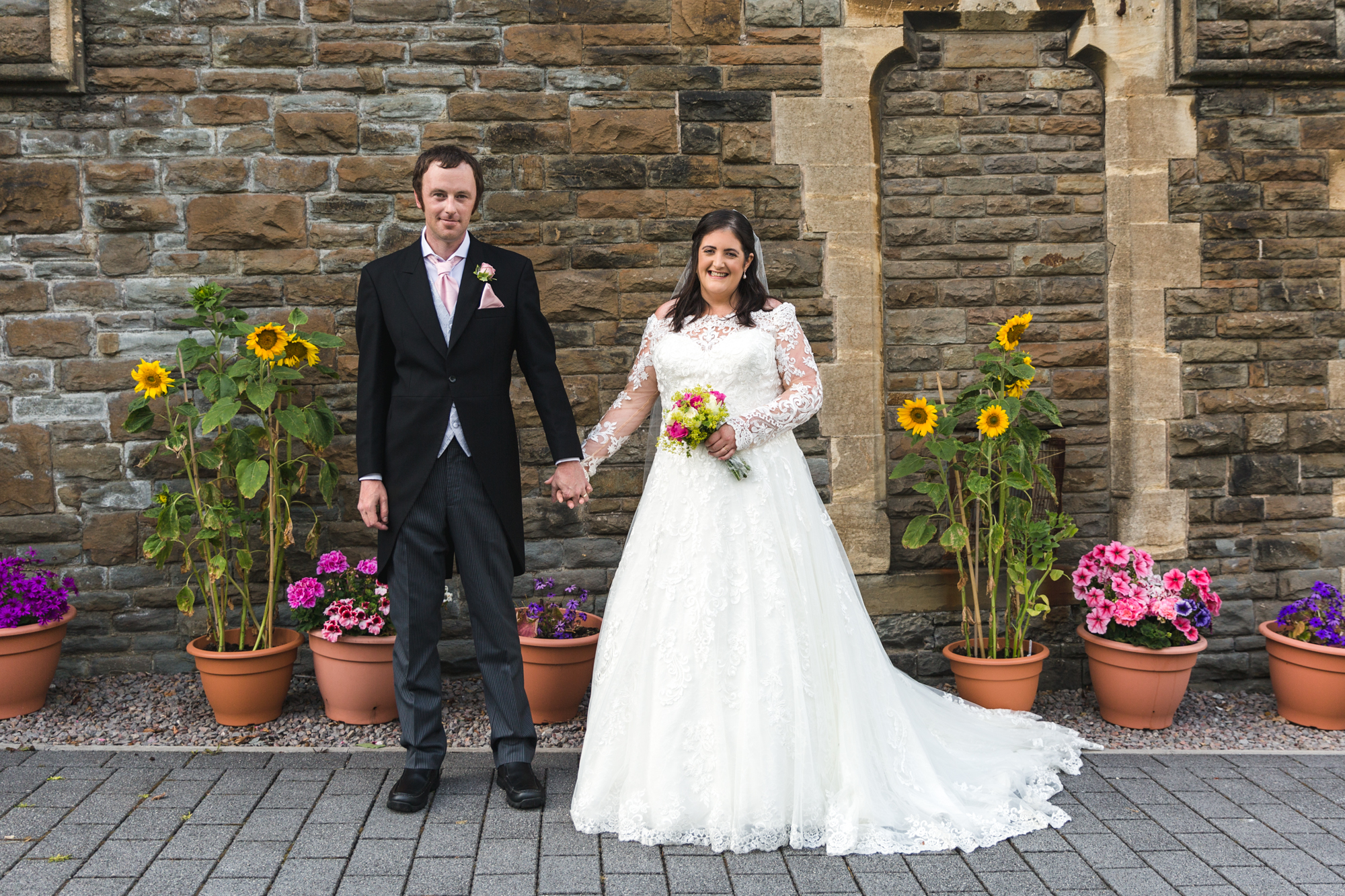 bride and groom portrait outside St Martins church, Caerphilly