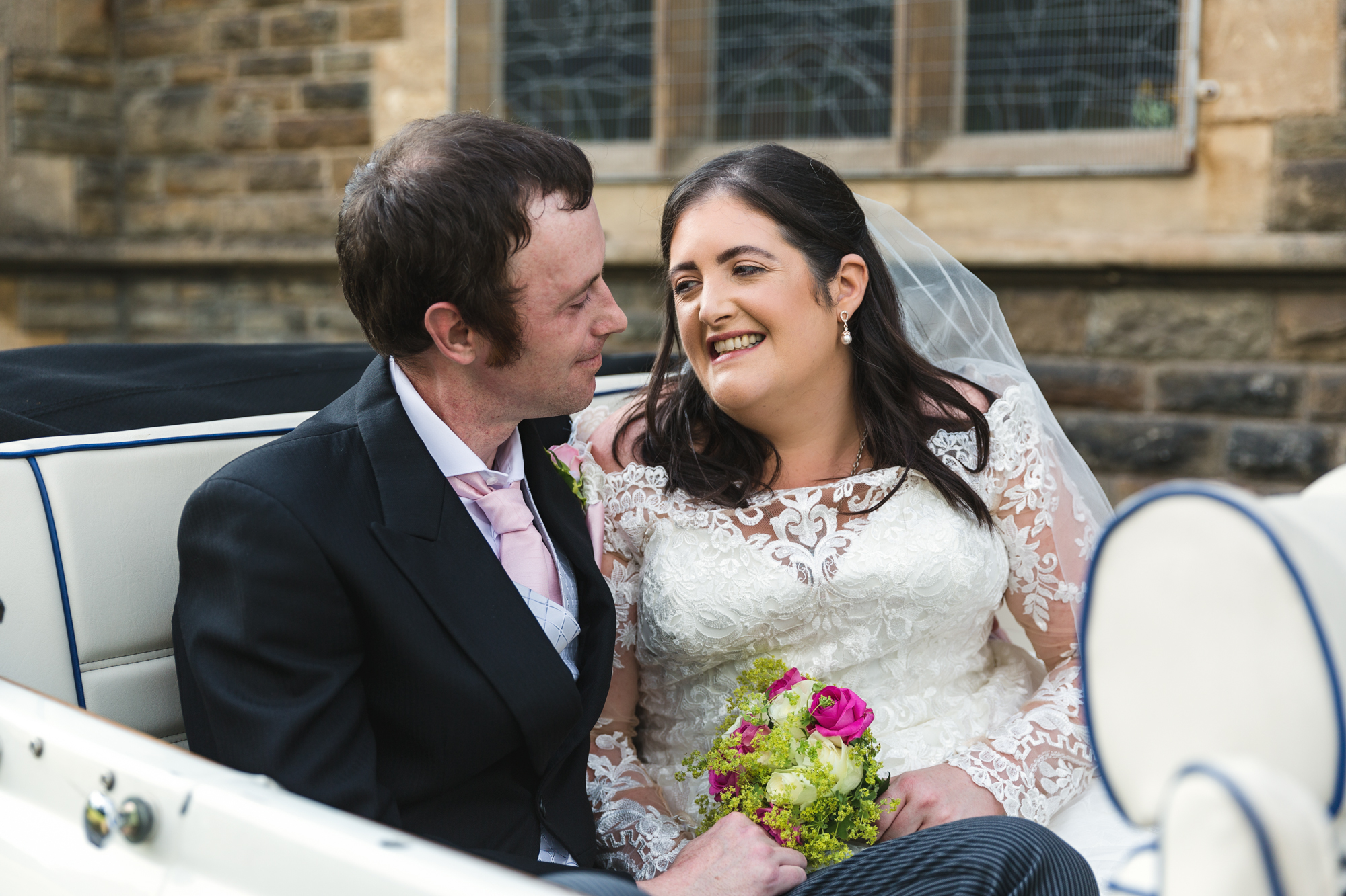 bride and groom photo in car outside St Martins Church, Caerphilly