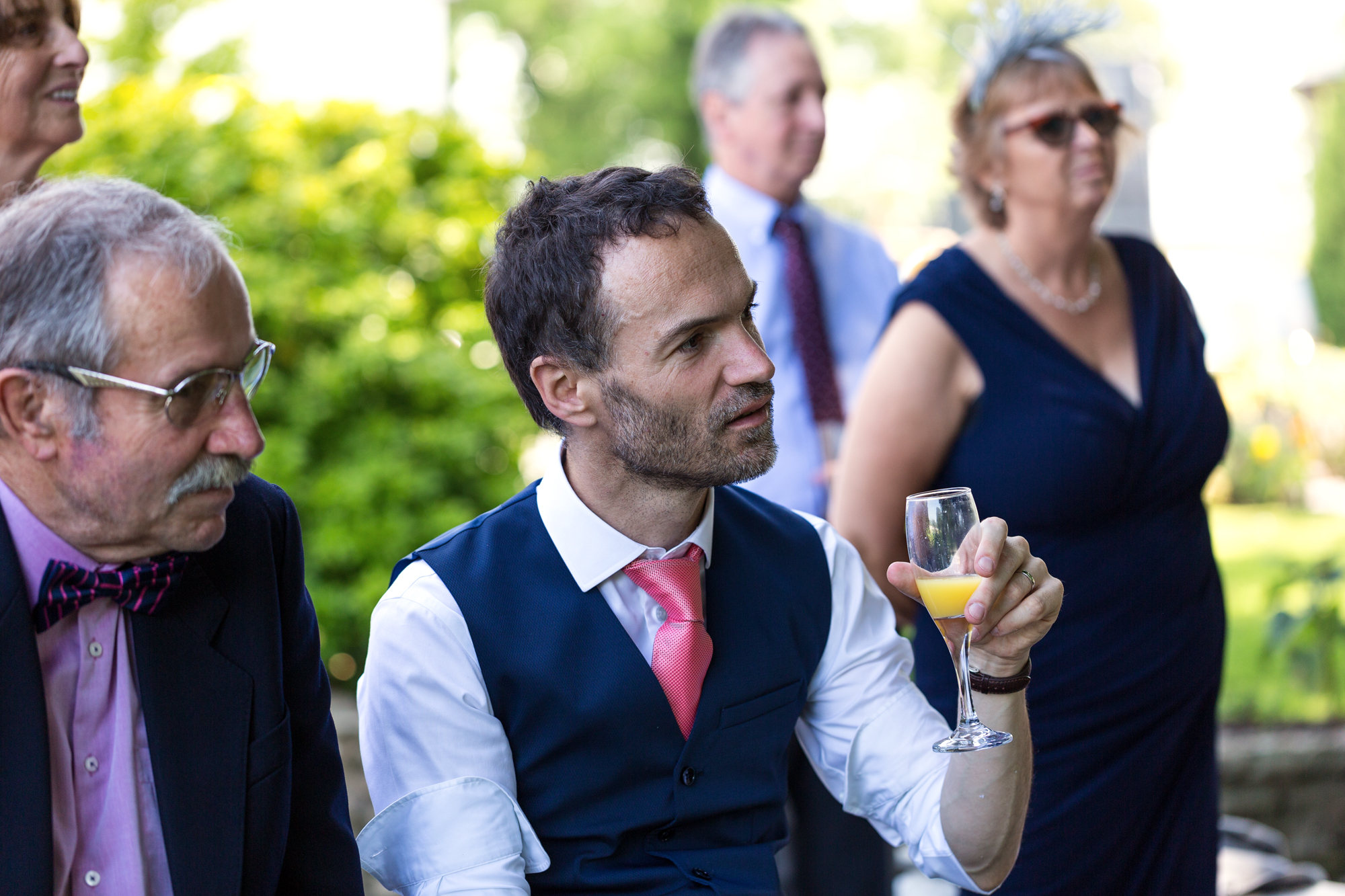 groom listening to Bargoed Male Voice choir at llechwen hall wedding reception