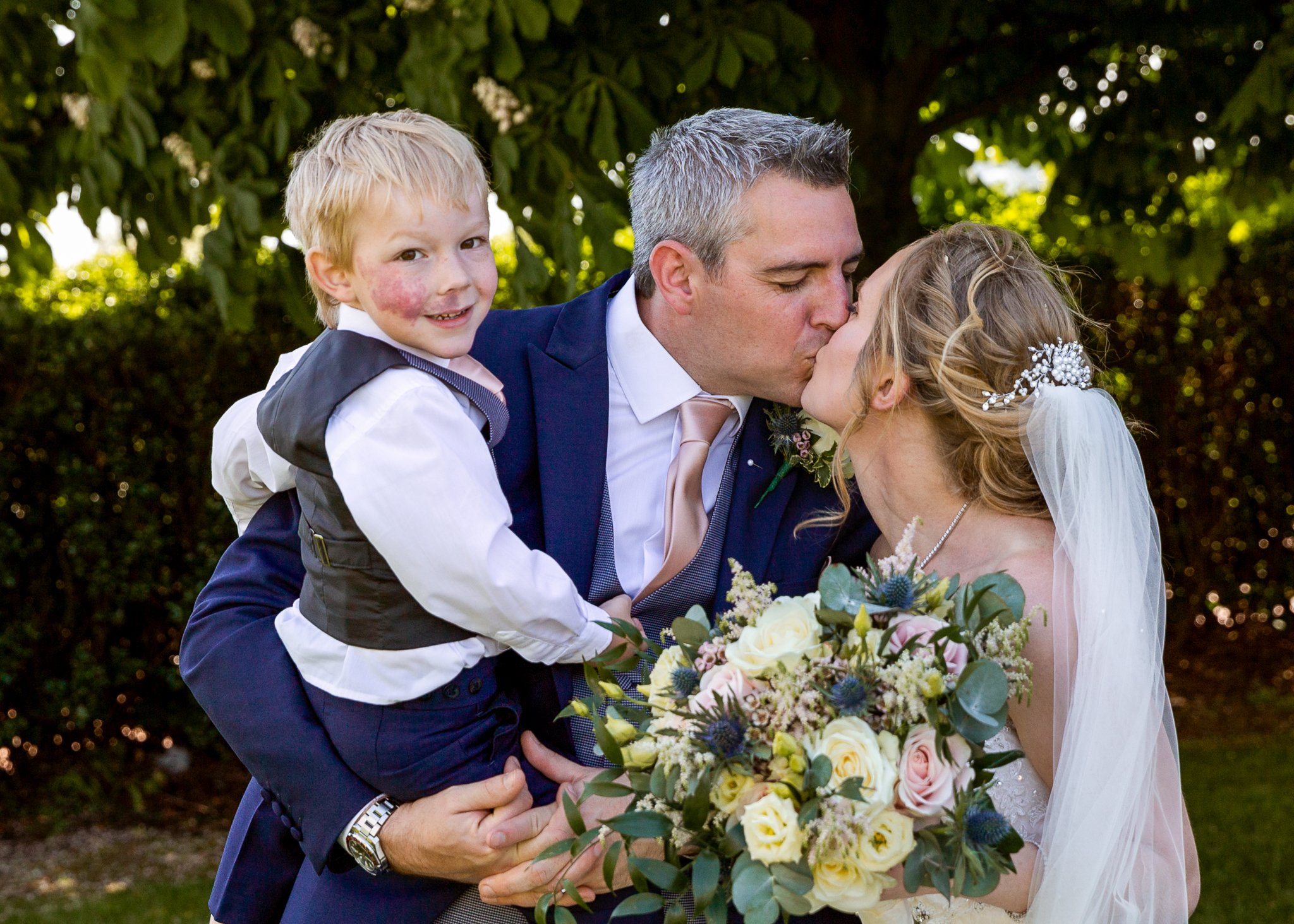 Bride, groom and son portraits at cardiff bay st davids hotel wedding