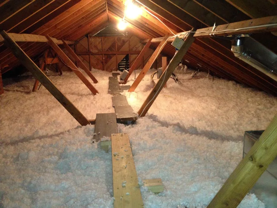About 16" of insulation were added - note the walkway created to access attic without compression of the insulation