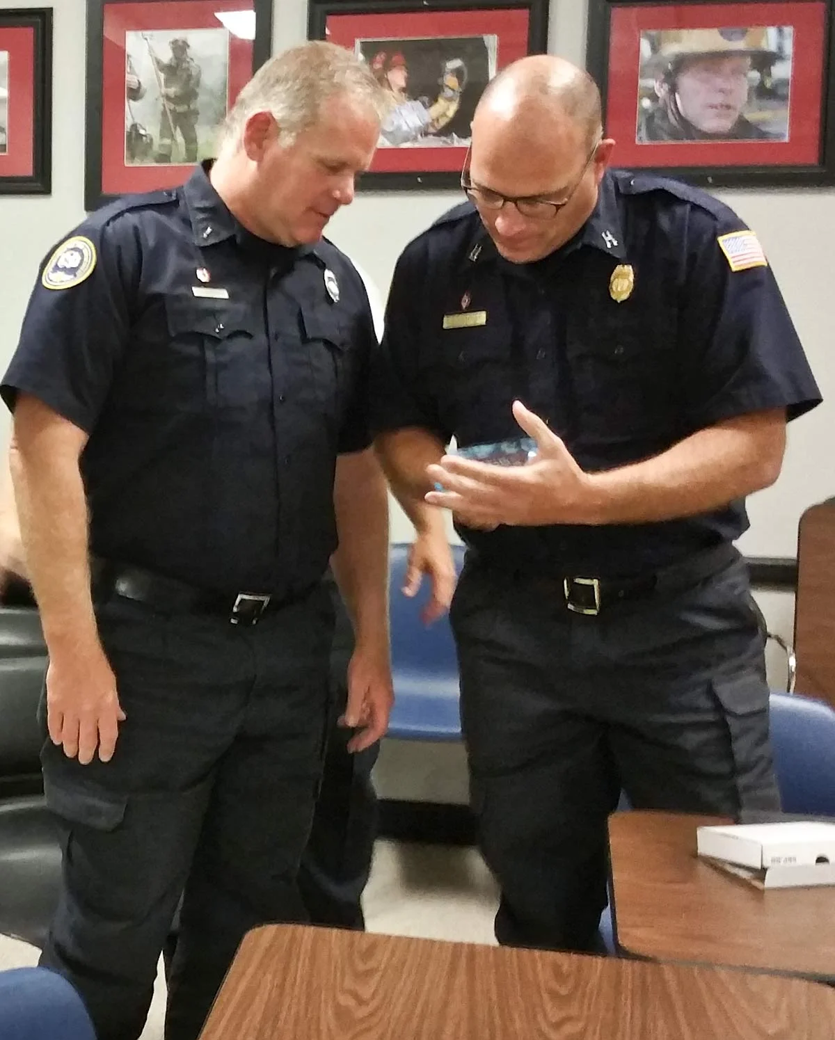 Lieutenant Craig Schmucker, Captain Eric Latimer, and Battalion Chief Scott Jones (not shown) receive plaque of appreciation presented on October 11, 2016 from the Phelps Grove Neighborhood Association.