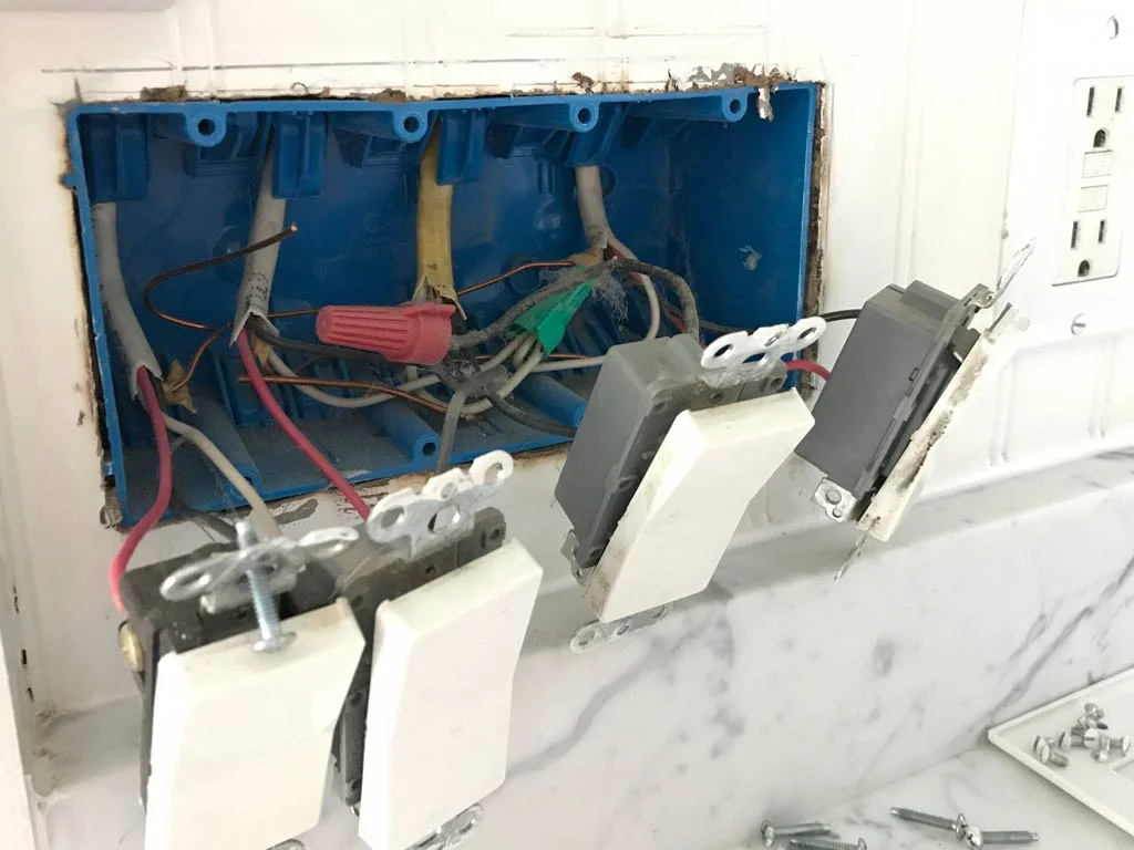 The switches are all removed and gently pulled away from the electrical box. Caution - you MUST turn off electricity before you do this. Zap-o-la awaits if you don't.