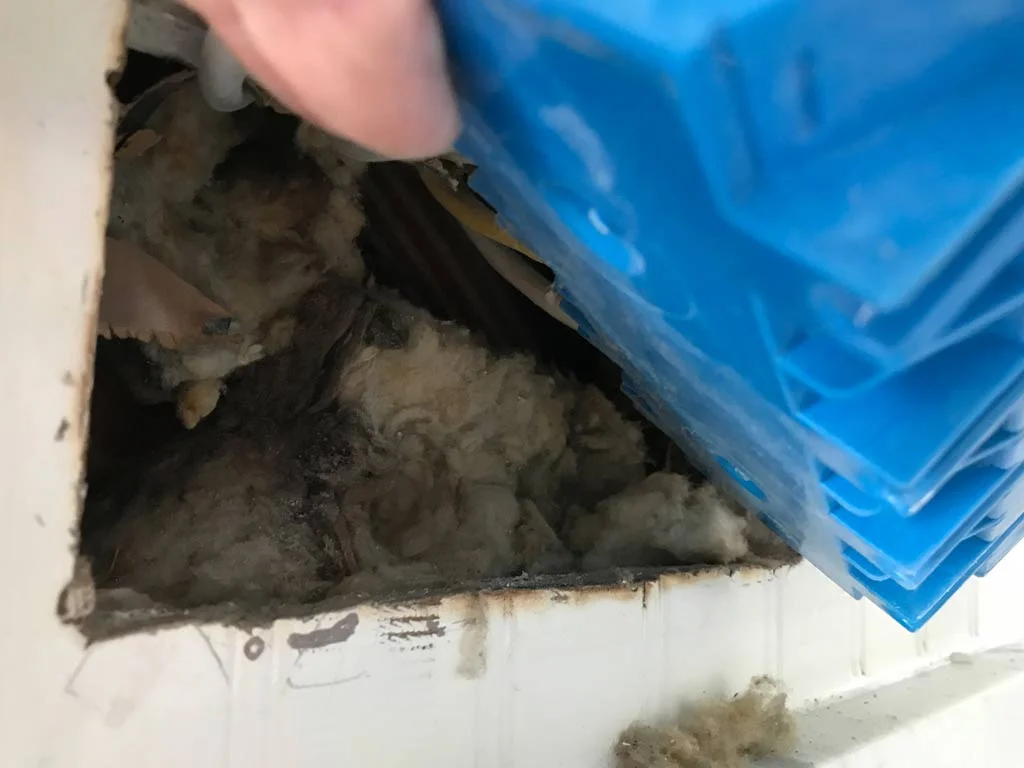 I removed the electrical box as I wanted to insulate behind it. The old insulation was mostly compressed and useless, so I added foal wrapped foam sheet insulation behind this box after measuring to see if it would fit.