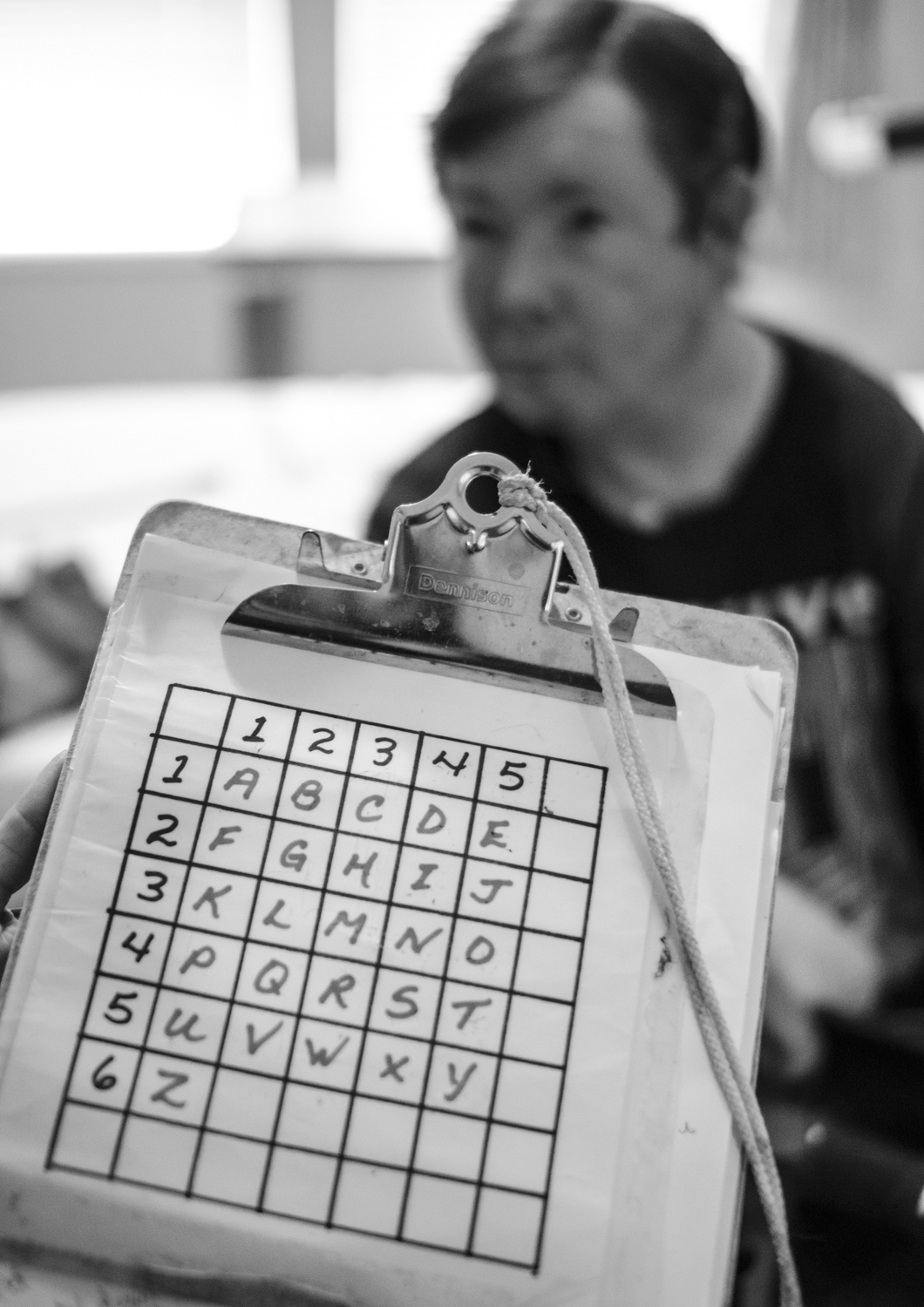 Beany and Stephanie's communication hinges on a simple system of letters and numbers laid out in grid. By blinking Beany can indicate a column and then a row slowly amassing words and sentences. 