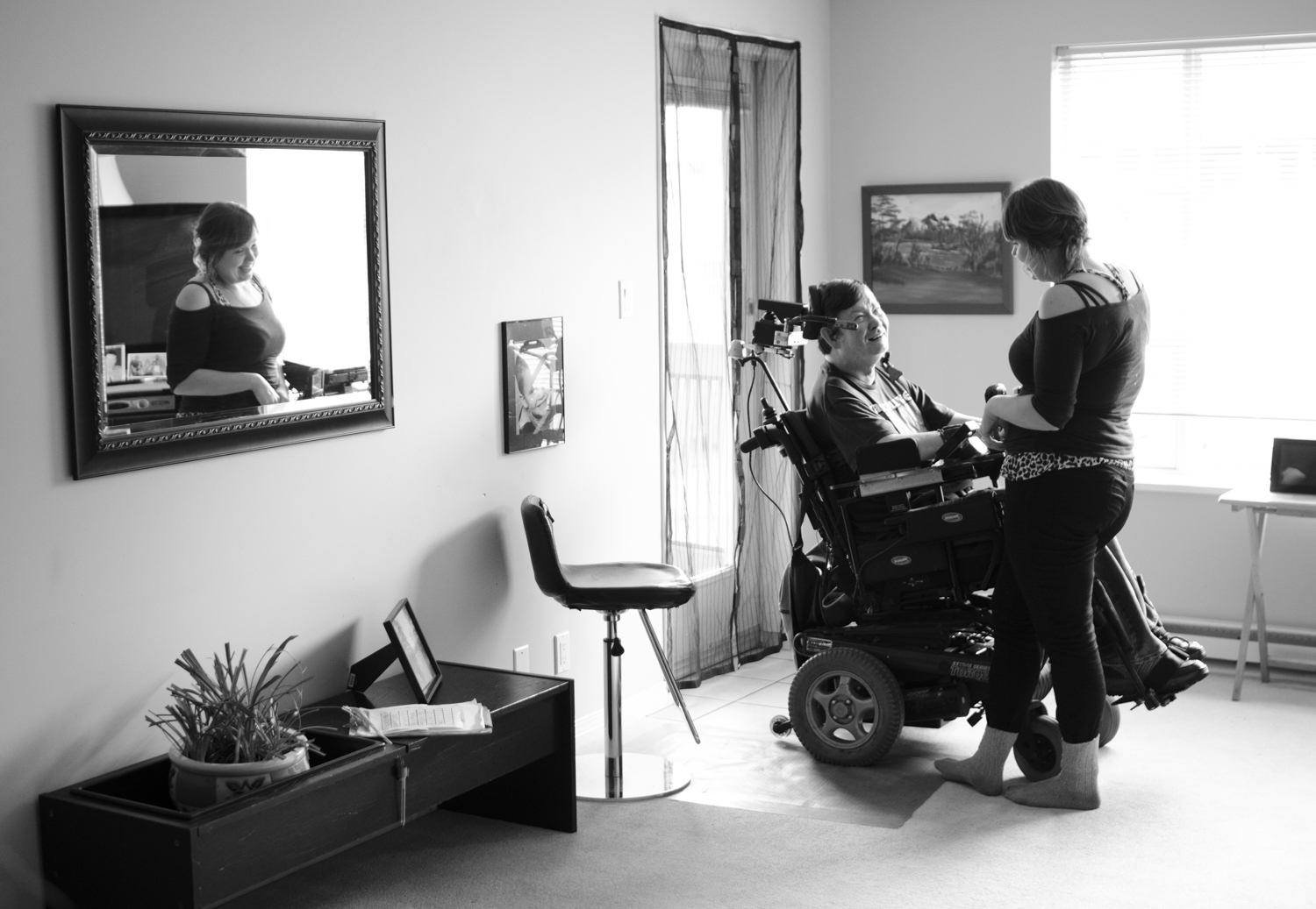 Beany and Stephanie share a laugh in his apartment outside Victoria, BC. Having spent so much time together they have developed an intuitive language all their own full of witty humour and compassion. 