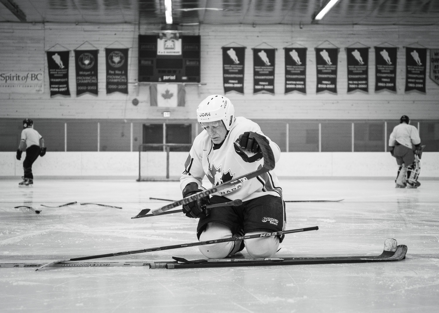 "Coach" tossing sticks to decide teams at Argenta's weekly ice time in Kaslo. It is currently the longest running one at the arena with the players hitting the ice every Sunday at 4pm. 
