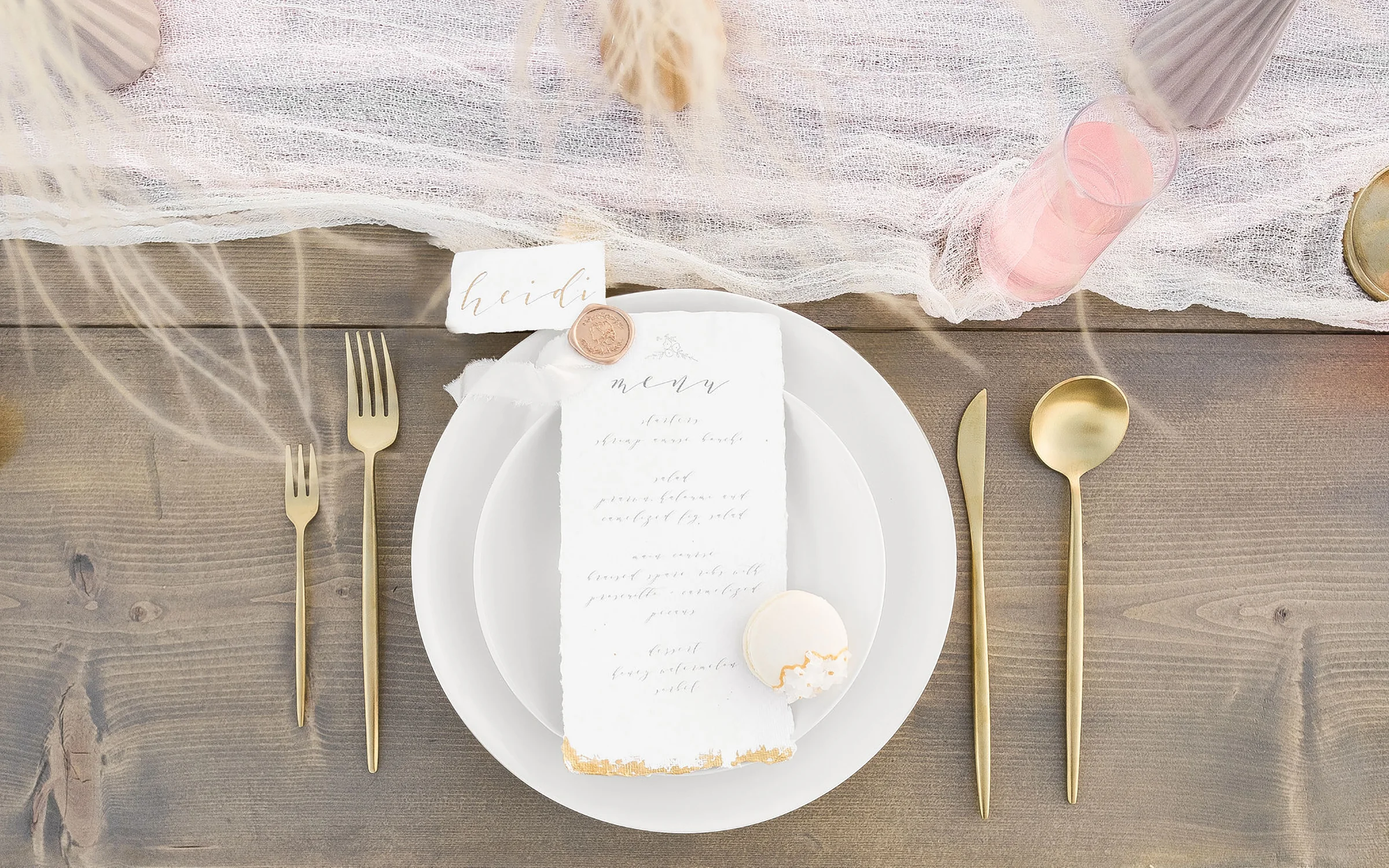 Table by Bloomingbelles , macaron baked by Emy Ray Bakes, foliage by Mylo Fleur , wax seal and ribbon by Artisaire , paper by Indian Cotton Paper Co. , Photography and stationery design by Claire Falco Creative