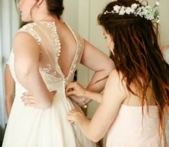 ButtoningUpDress.jpg