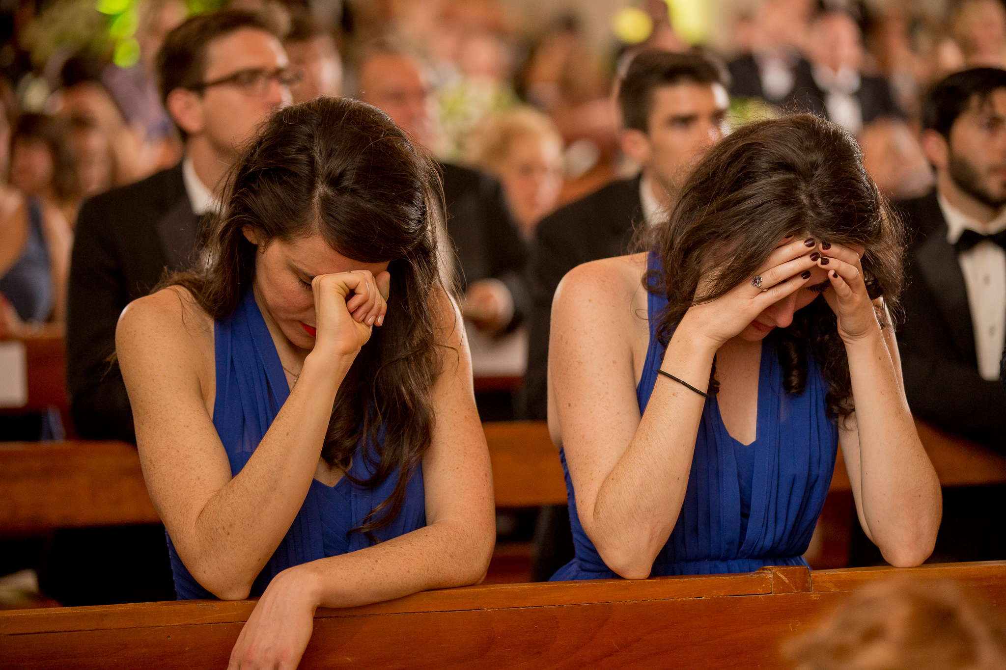 My sister and me, praying during our brother's wedding in 2015. This was a particularly difficult moment in my waiting season as a single woman, which I think comes through in my posture and facial expression. Photo by Yorch Sans Fotografia. 