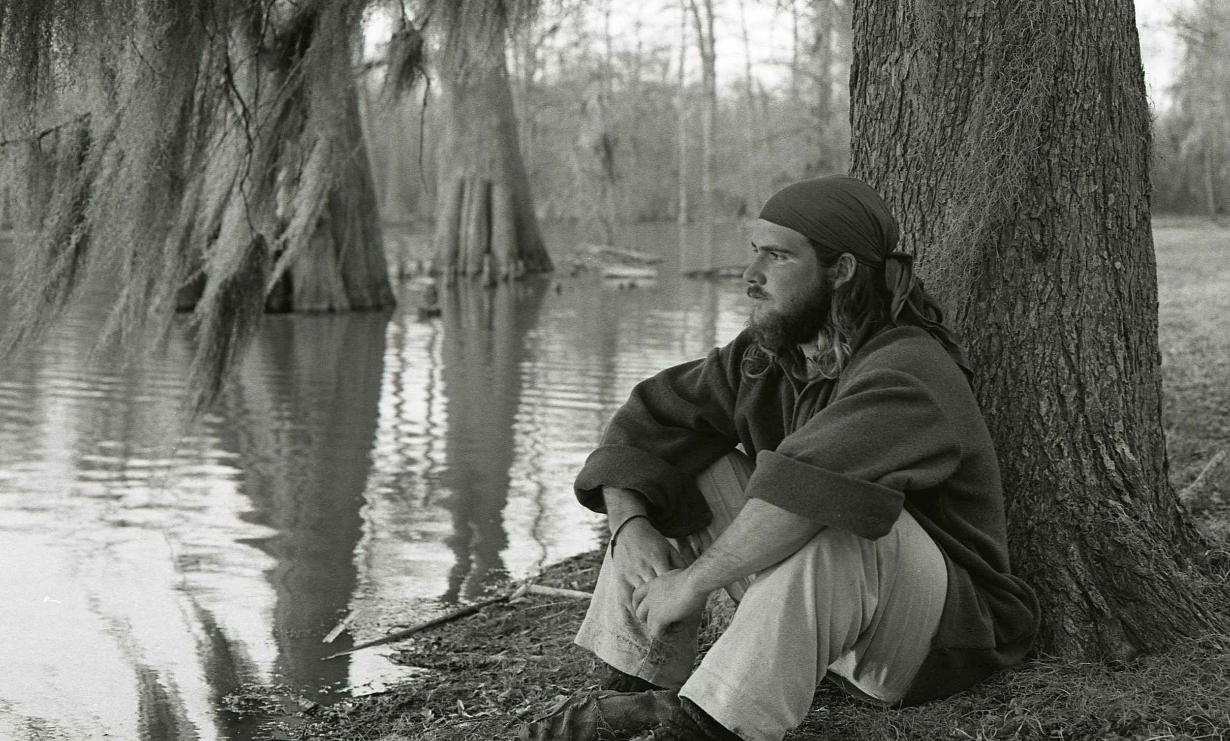 John DiFulvio leans against a tree deep in the Mississippi Delta in April 1977. As the end of La Salle: Expedition II winds down, he considers the journey's end and the many journeys of life that lie ahead. (Photo by Marc Lieberman)
