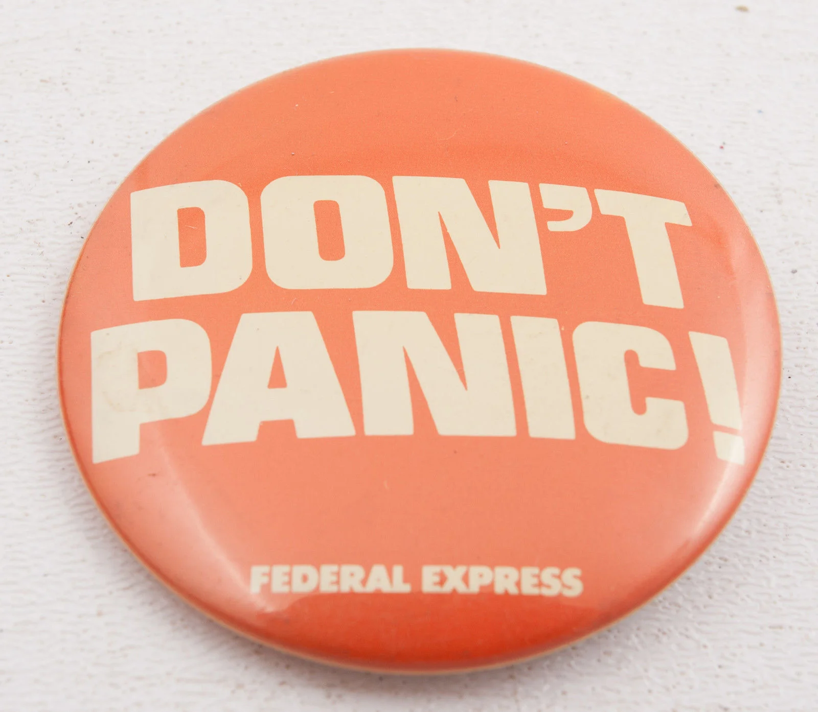 Vintage federal express "don't panic" button, circa 1978