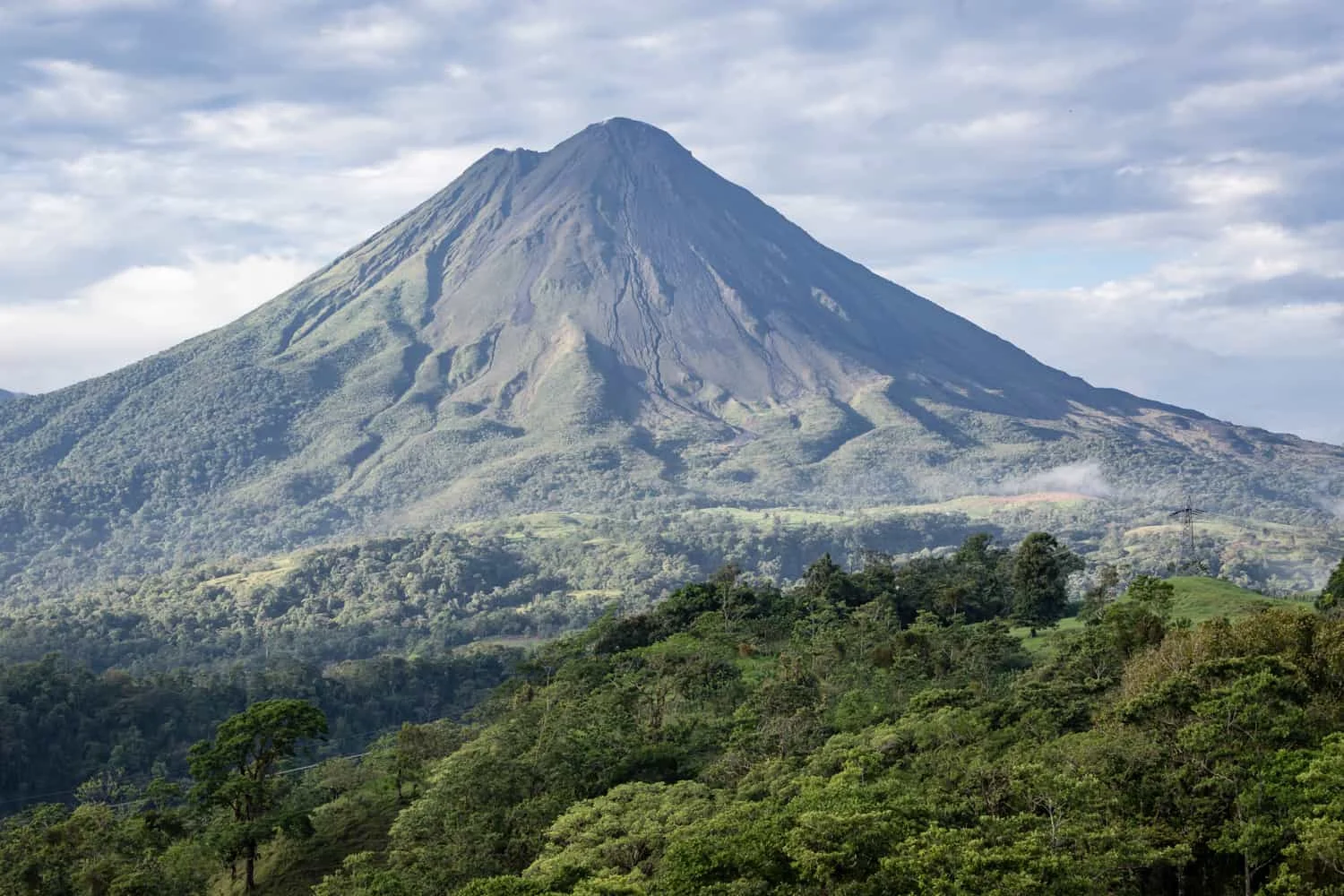 View the Arenal Volcano from from a hill near its base at a wedding venue in La Fortuna, Costa Rica.