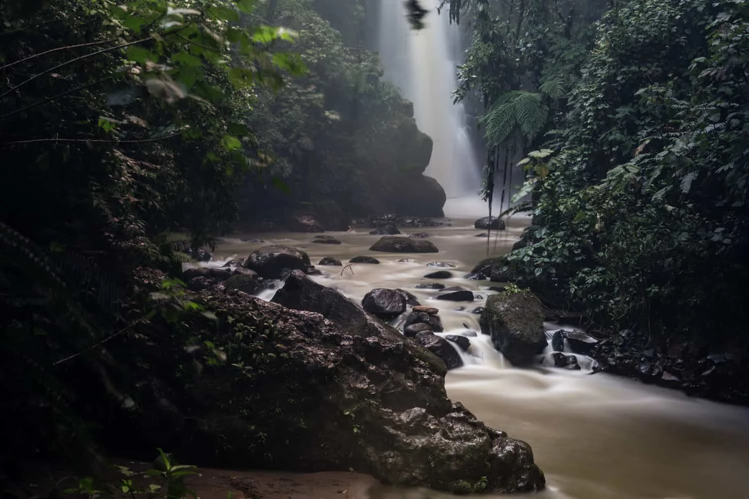 The Magia Blanca Waterfall is an amazing backdrop for a riverbank elopement or ceremony at La Paz Waterfall Gardens.