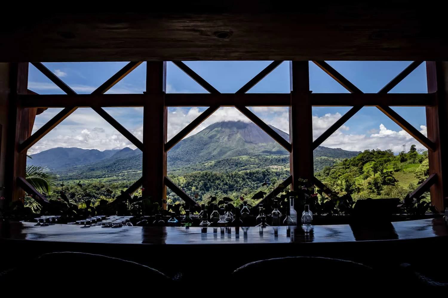 View of Areal Volcano from a bar in The Springs Resort & Spa Reception Building in La Fortuna.