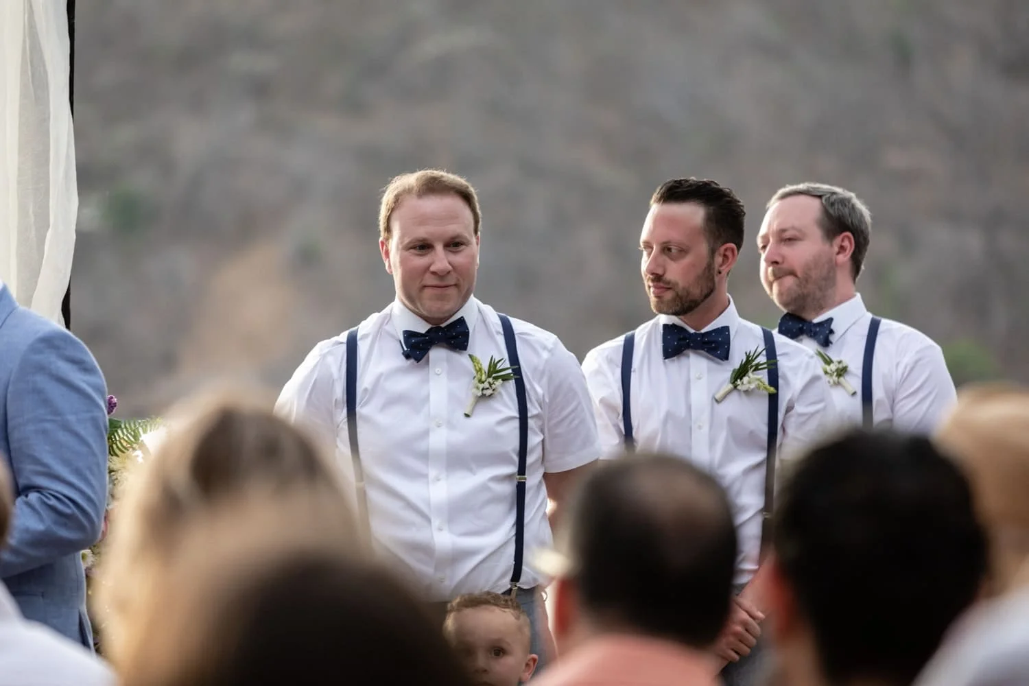 This groomsman didn't wear sunblock and got a nice sunburn and has a noticeable tan line from wearing a hat.