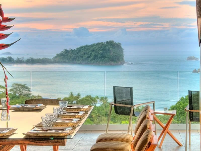 View of ocean from terrace at Villa Punto de Vista at sunset.